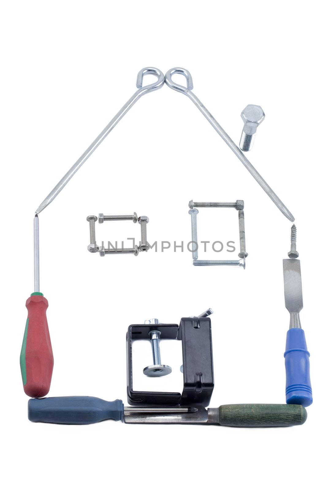 Various industrial tools forming a house over the white background 