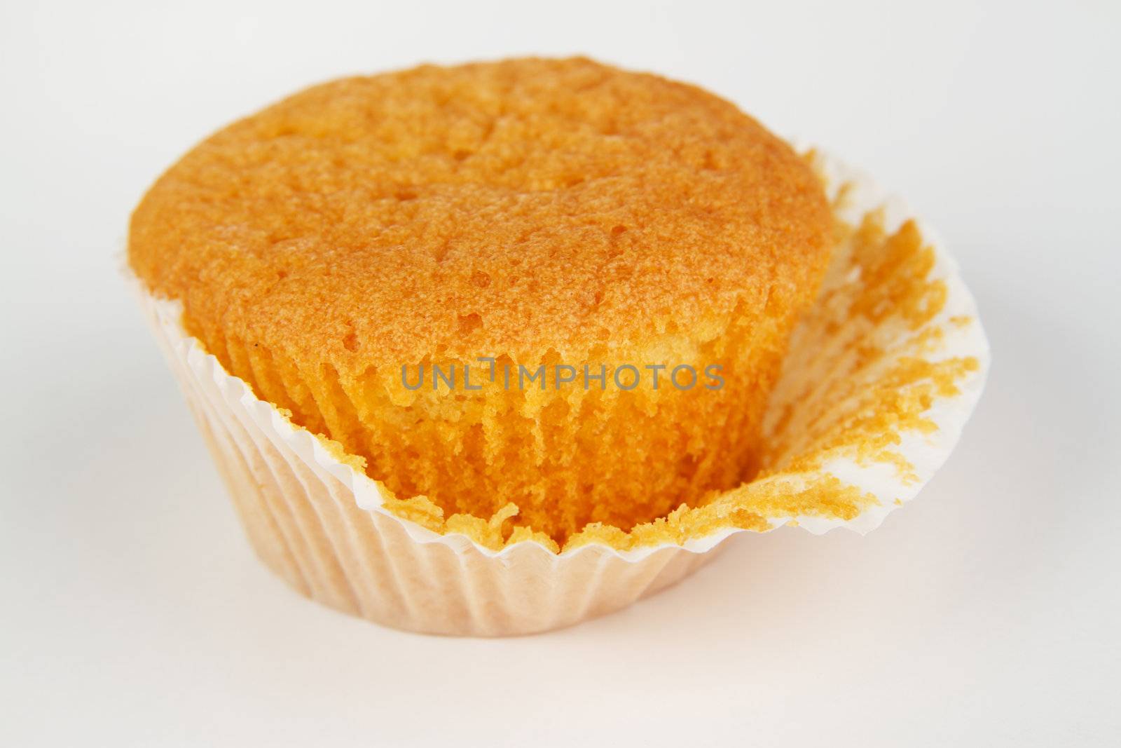 Sweet muffin against white background