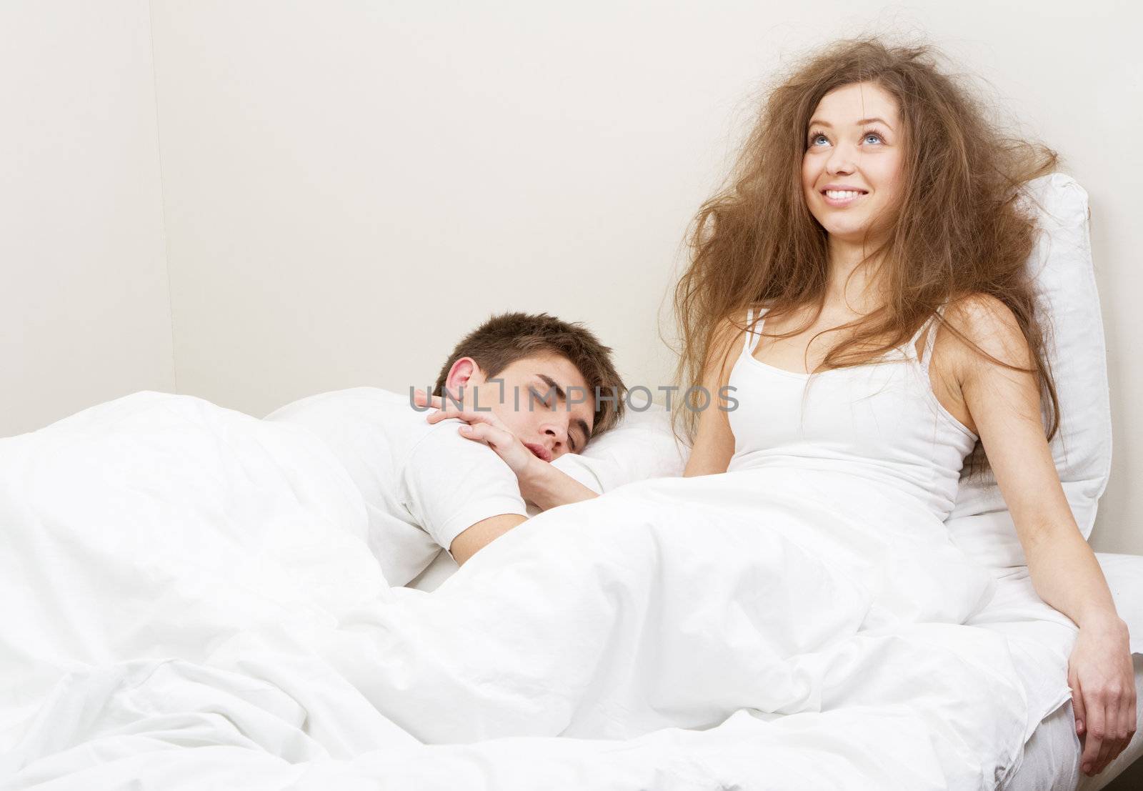 Young couple resting in bed