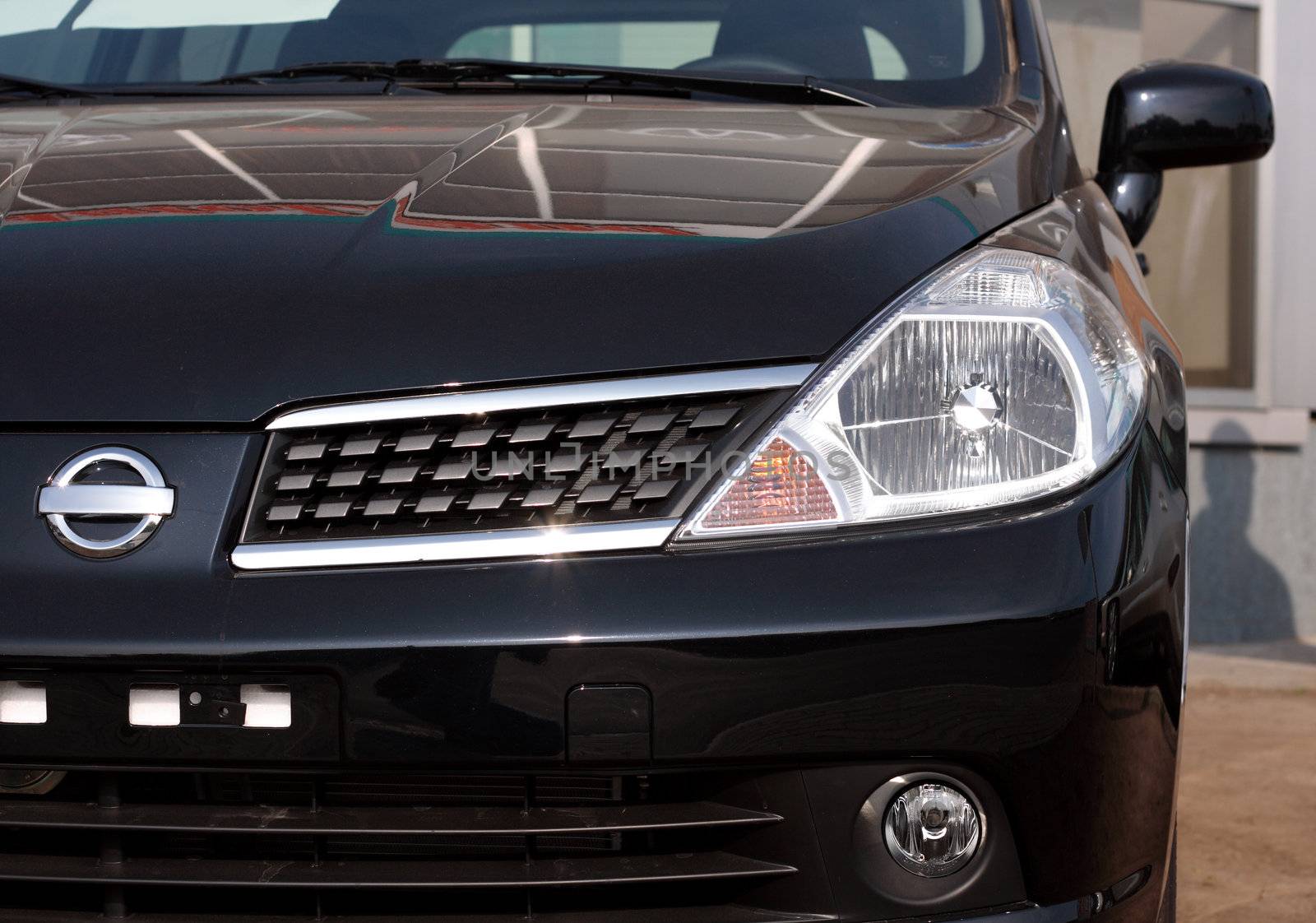 Close-up front view of a modern car by Gdolgikh