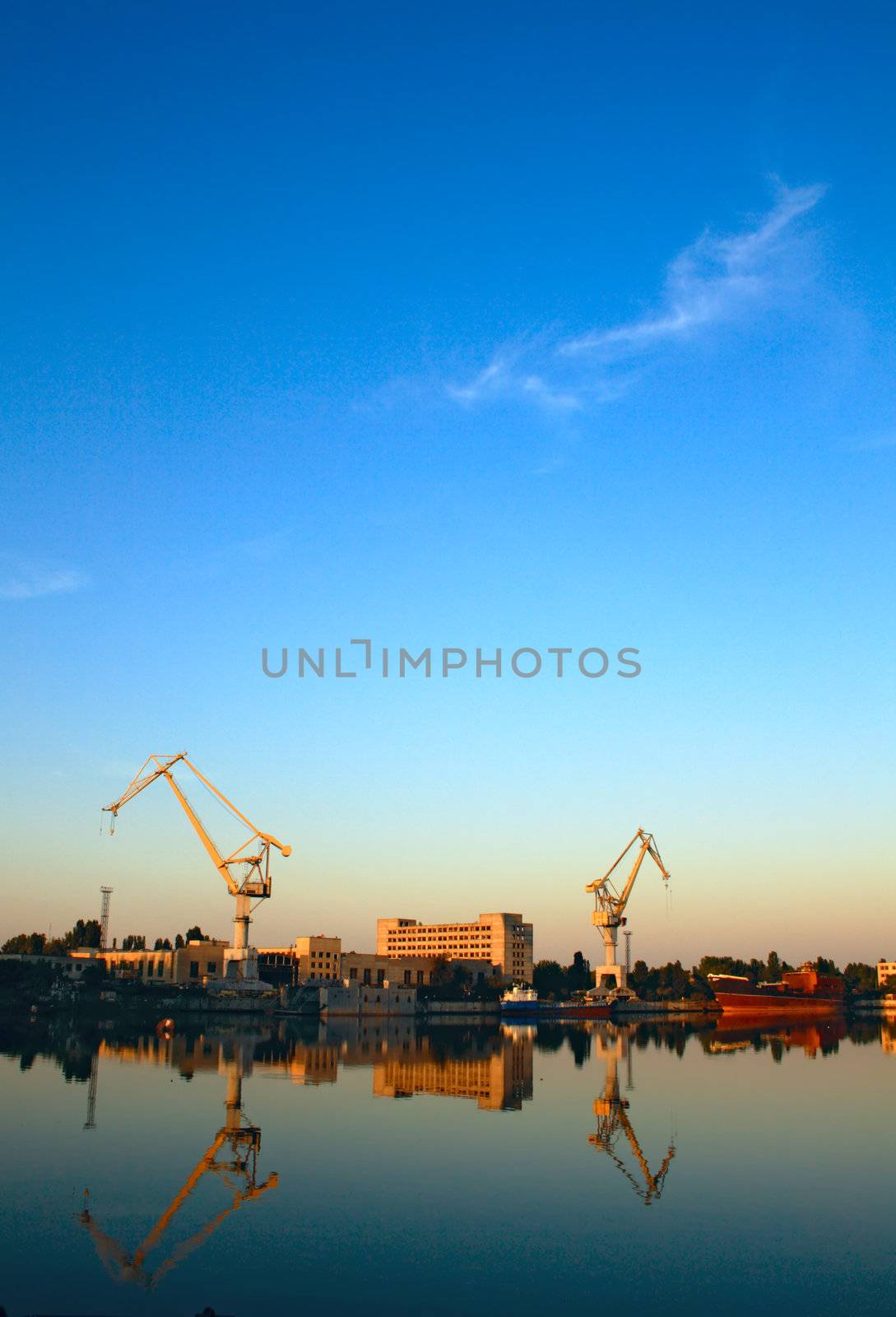 Wide-angle photo of cranes in a shipbuilding plant