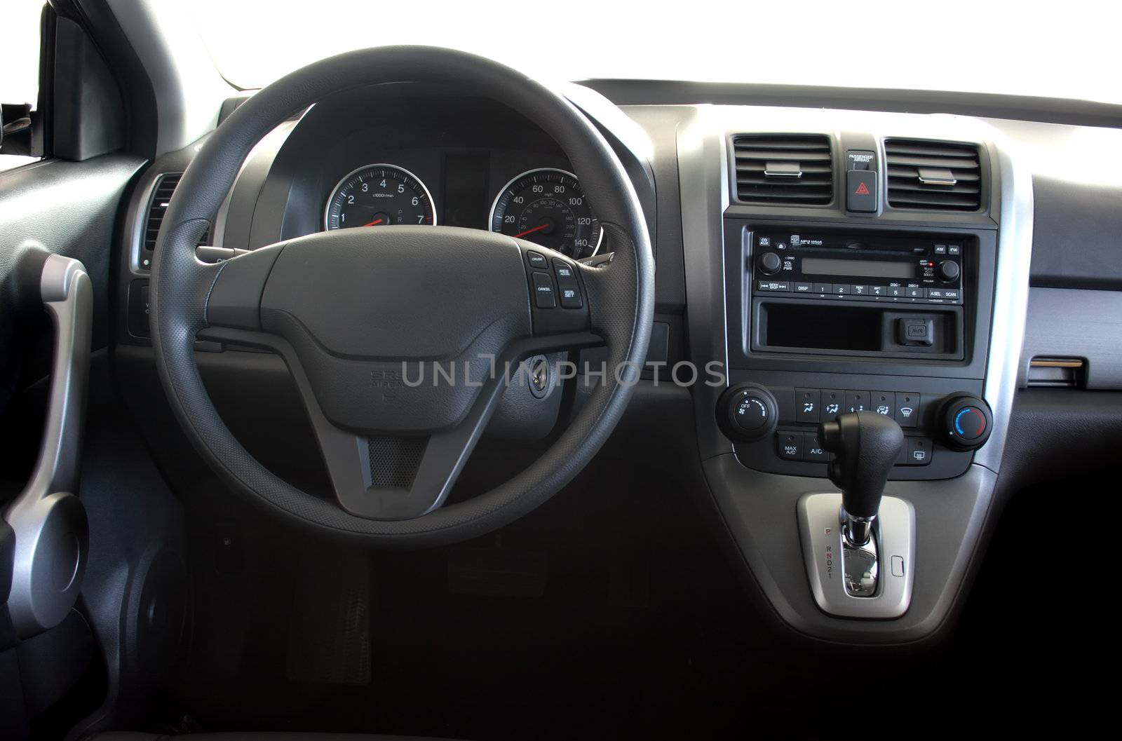 Interior of a car with view on steering wheel and dashboard