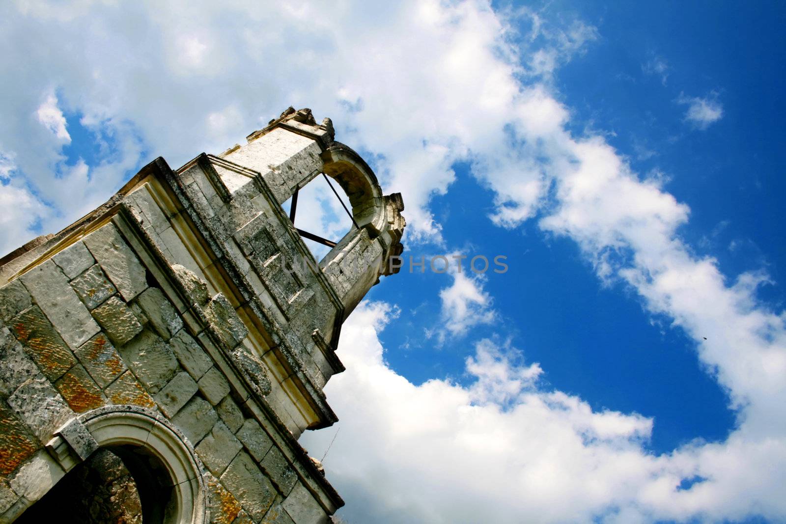 Ruins of an old church against a blue sky