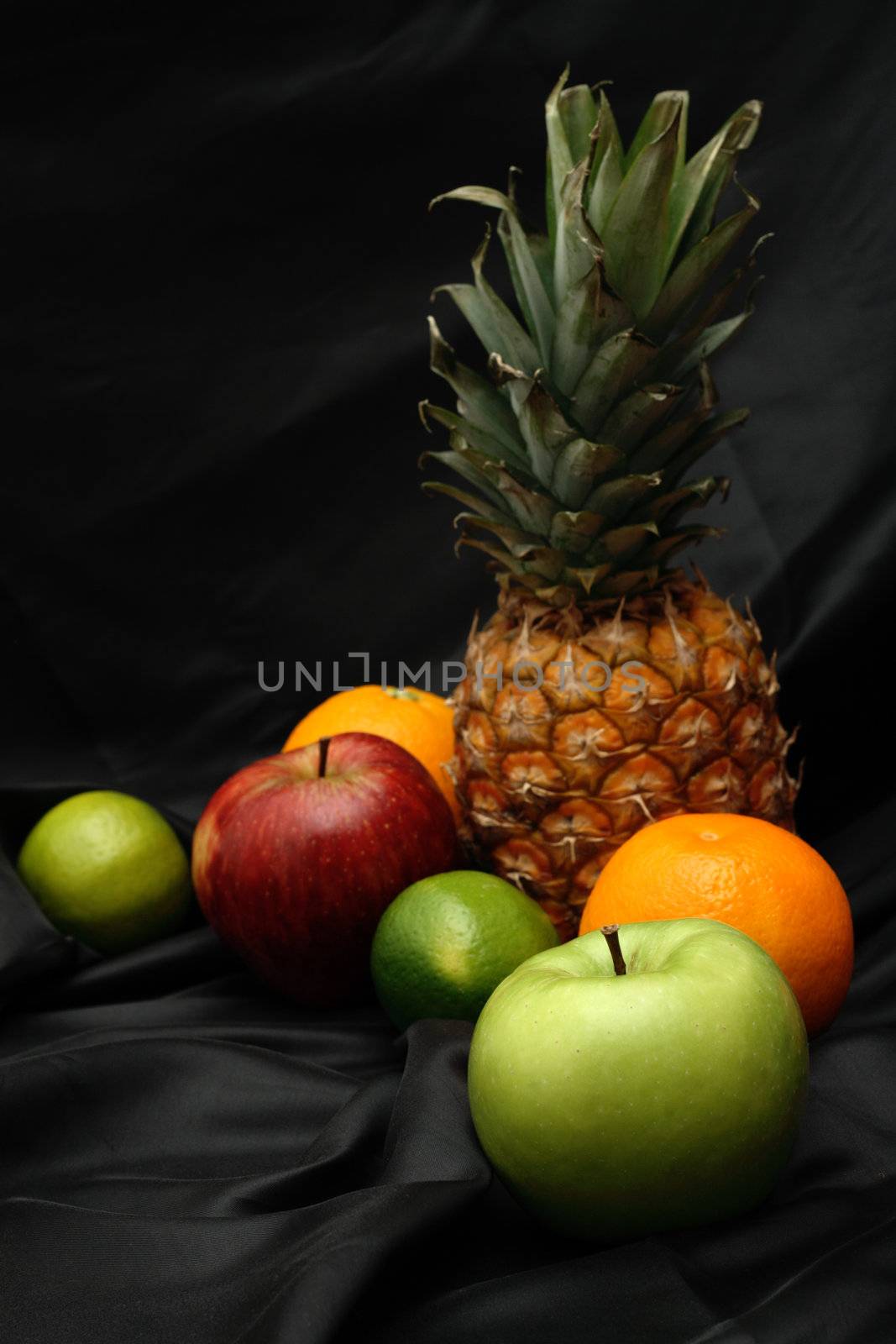 Fresh fruits on black background by Gdolgikh