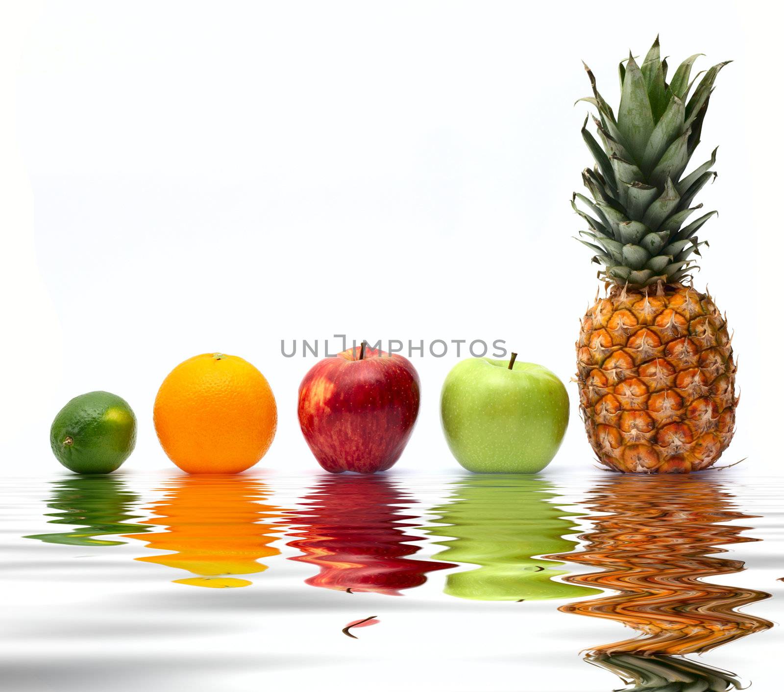 Row of fresh fruits reflected on water