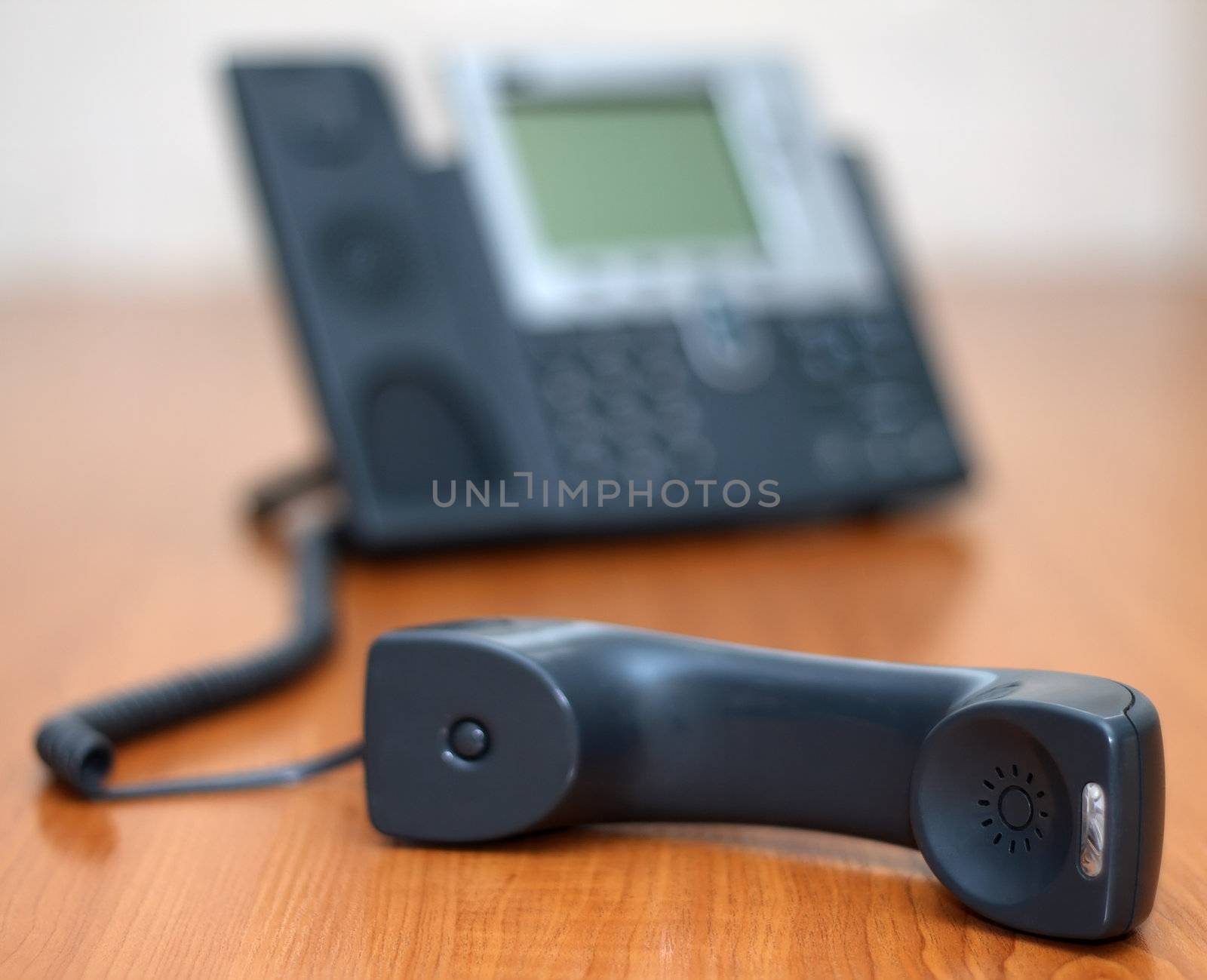Telephone receiver with phone on background by Gdolgikh