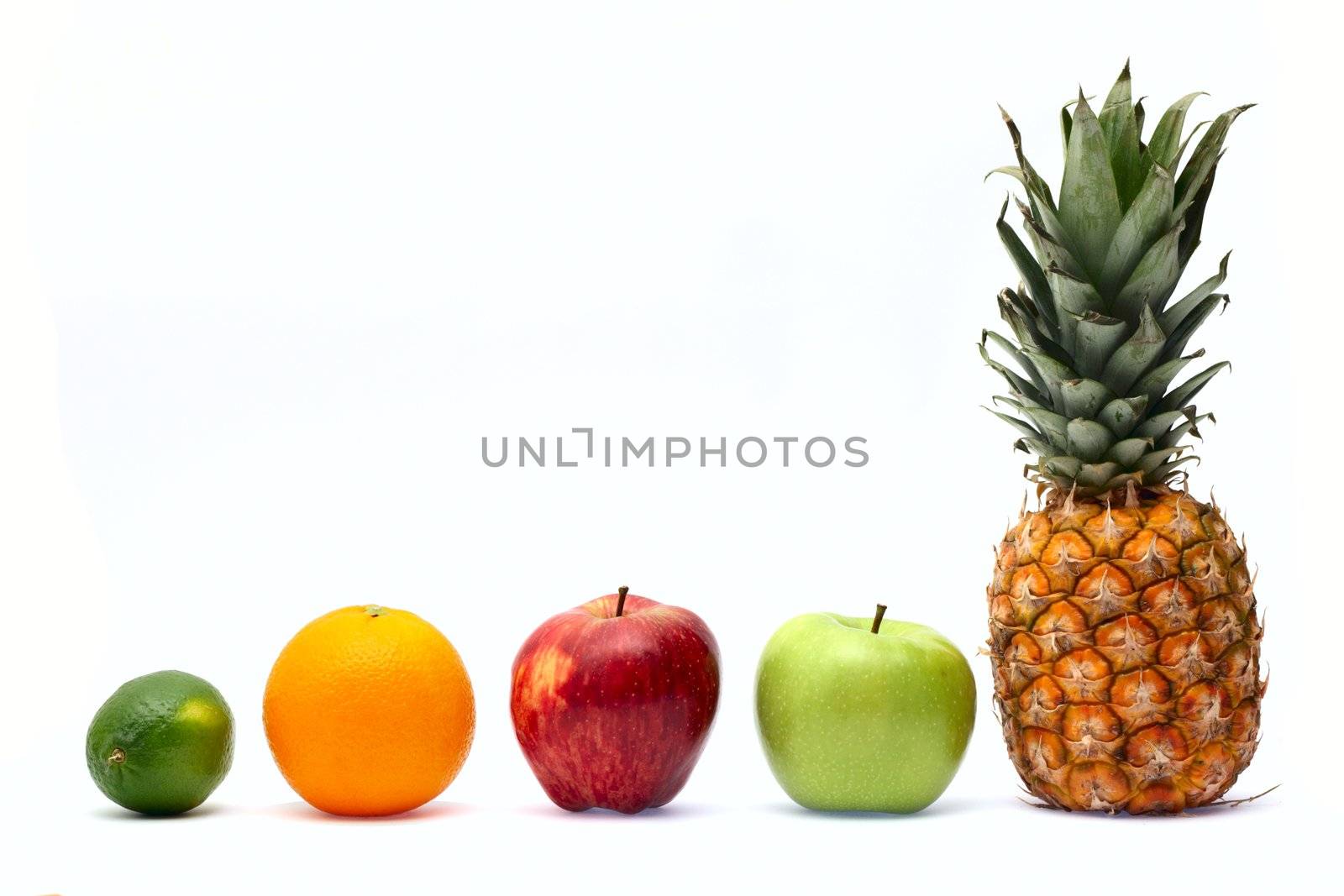Row of fresh ripe fruits isolated on white background