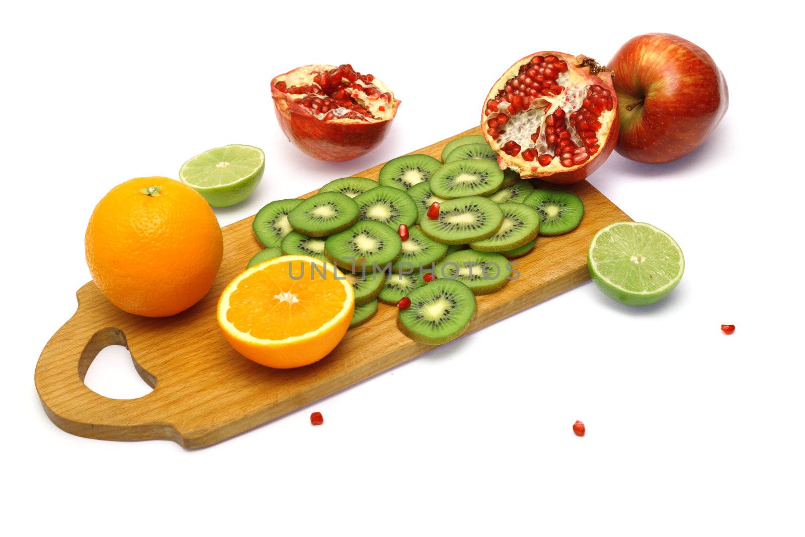 Board with cut fresh fruits isolated on white background