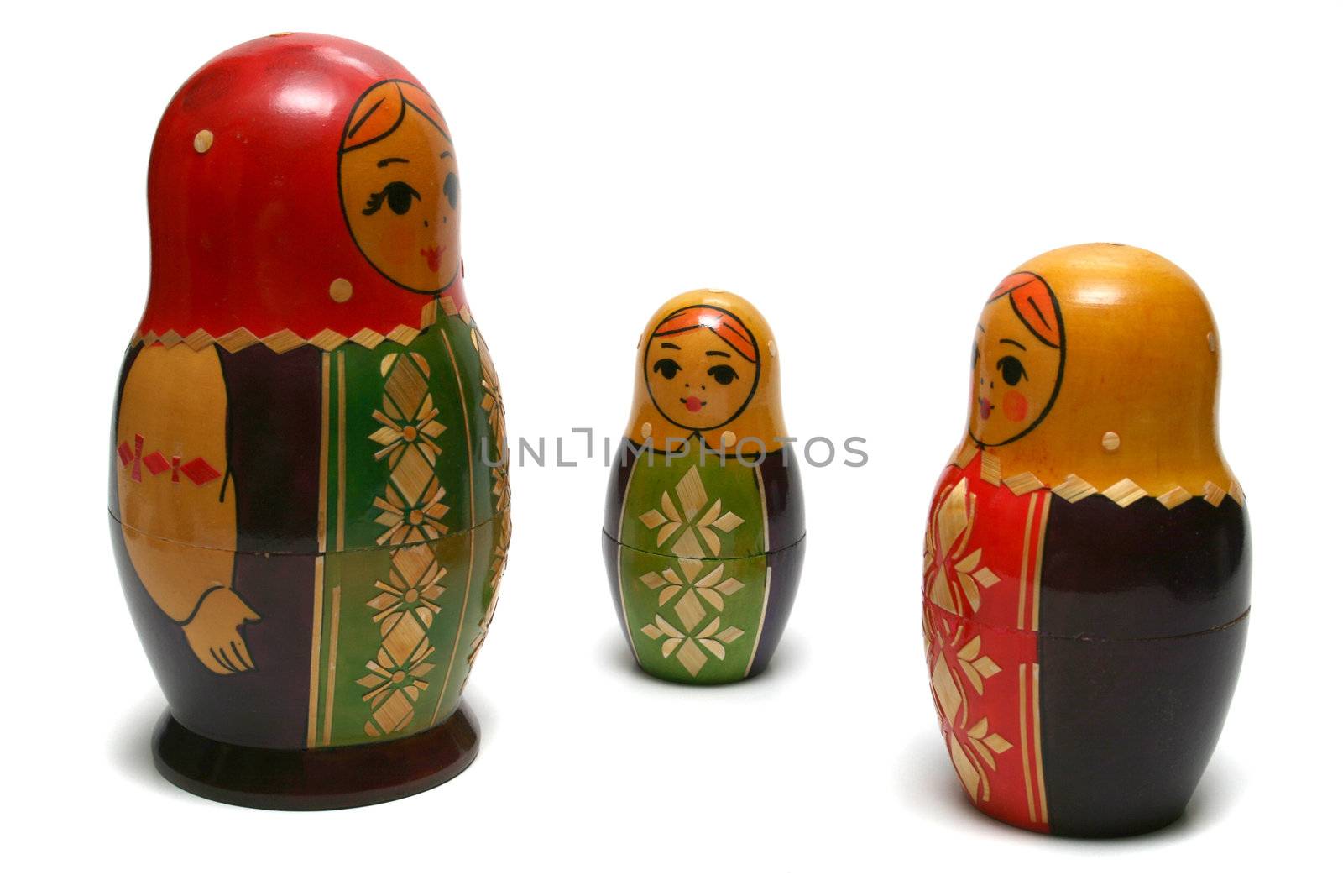 Three russian dolls isolated over white background