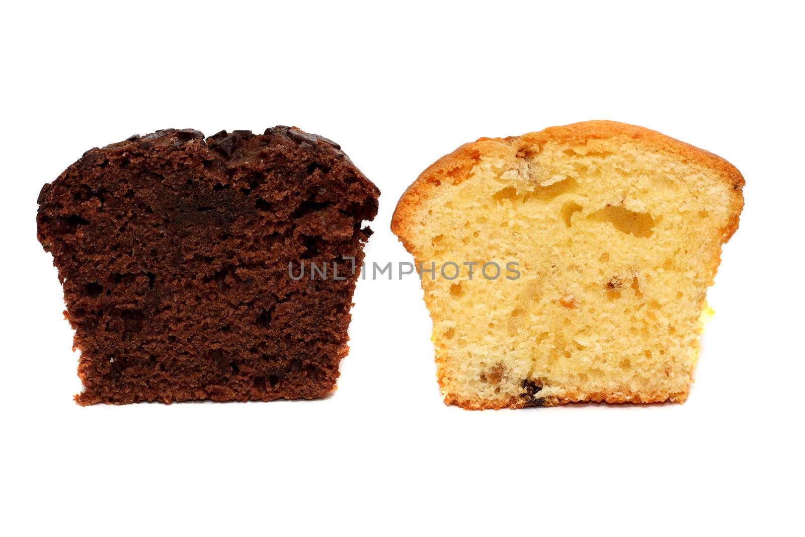 Dark and light muffin pieces standing nearby isolatedo on white
