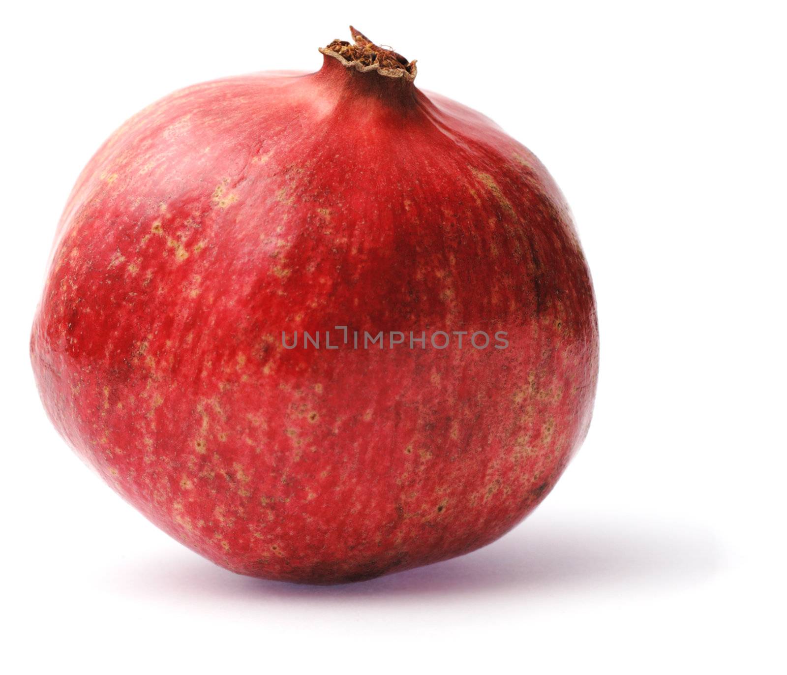 Pomegranate isolated on white by Gdolgikh