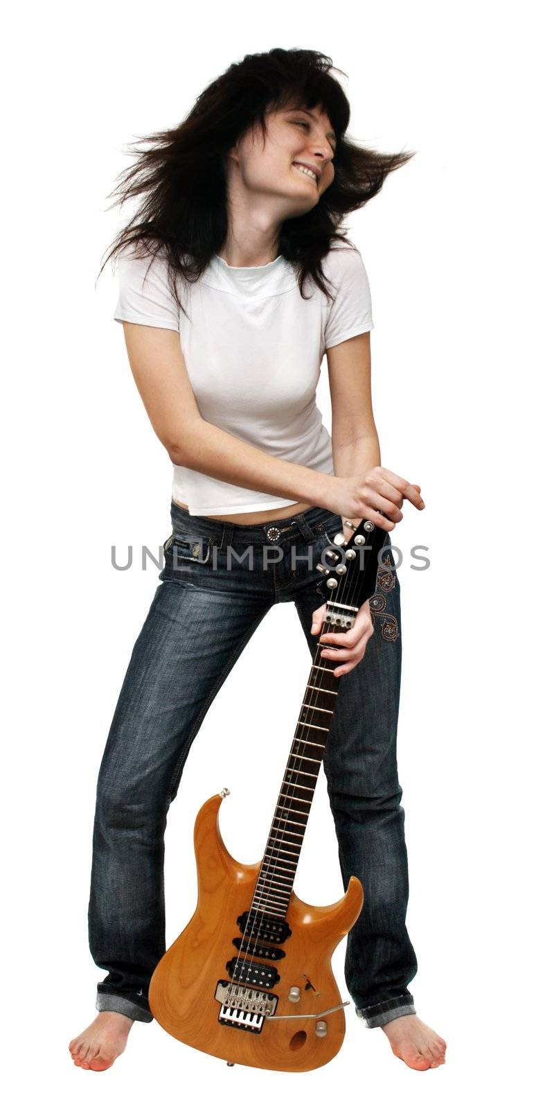 Pretty girl shaking her head holding an electric guitar