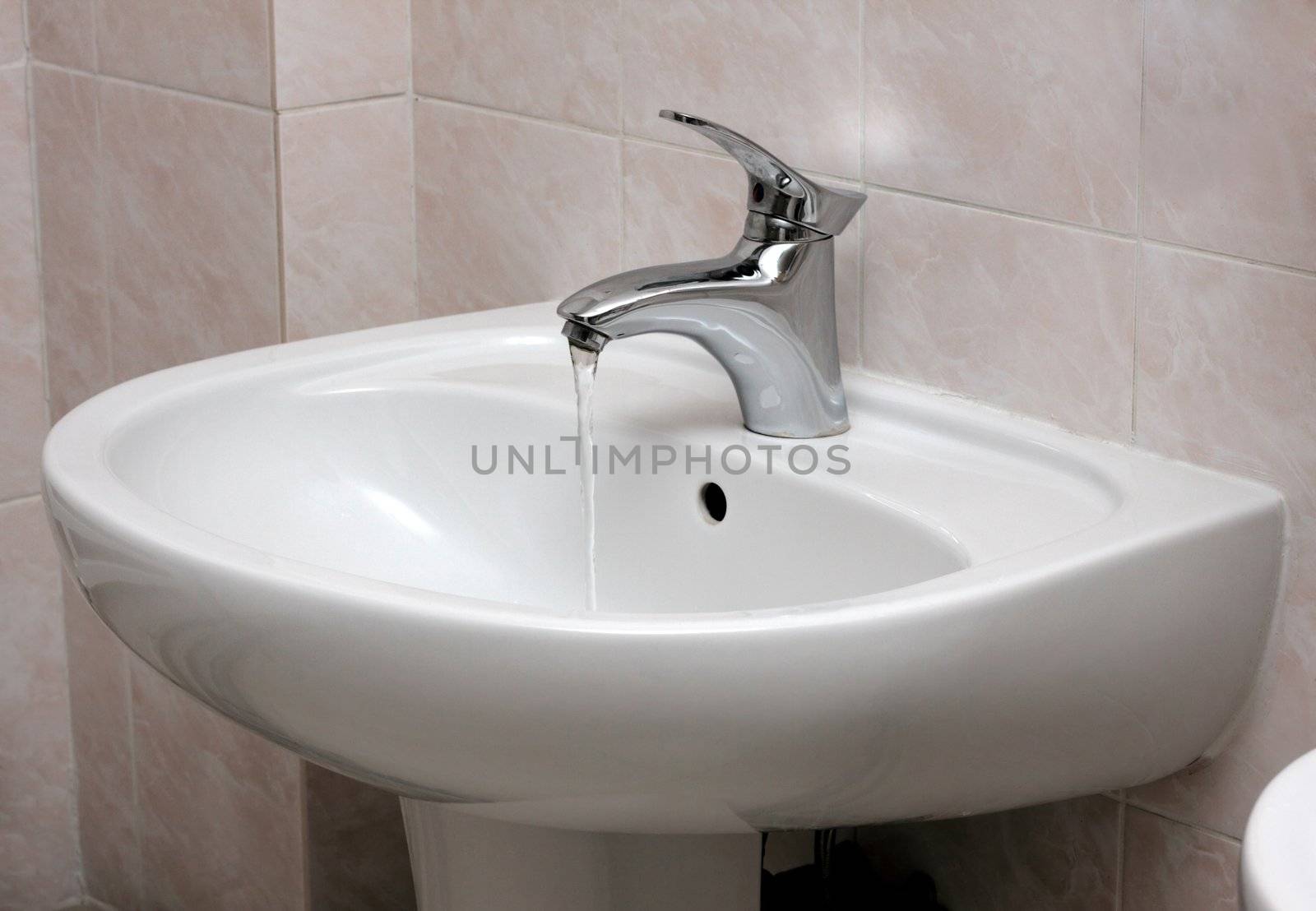 Open modern water faucet and basin by Gdolgikh