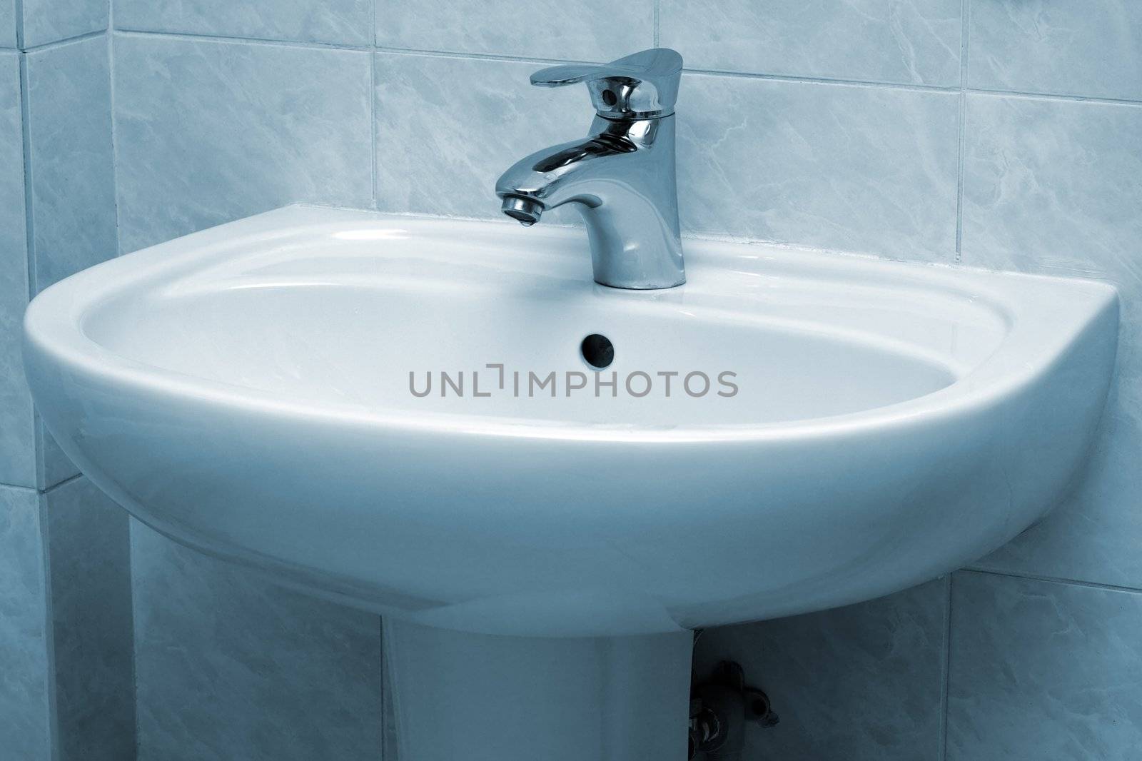 Water faucet and basin in blue tint