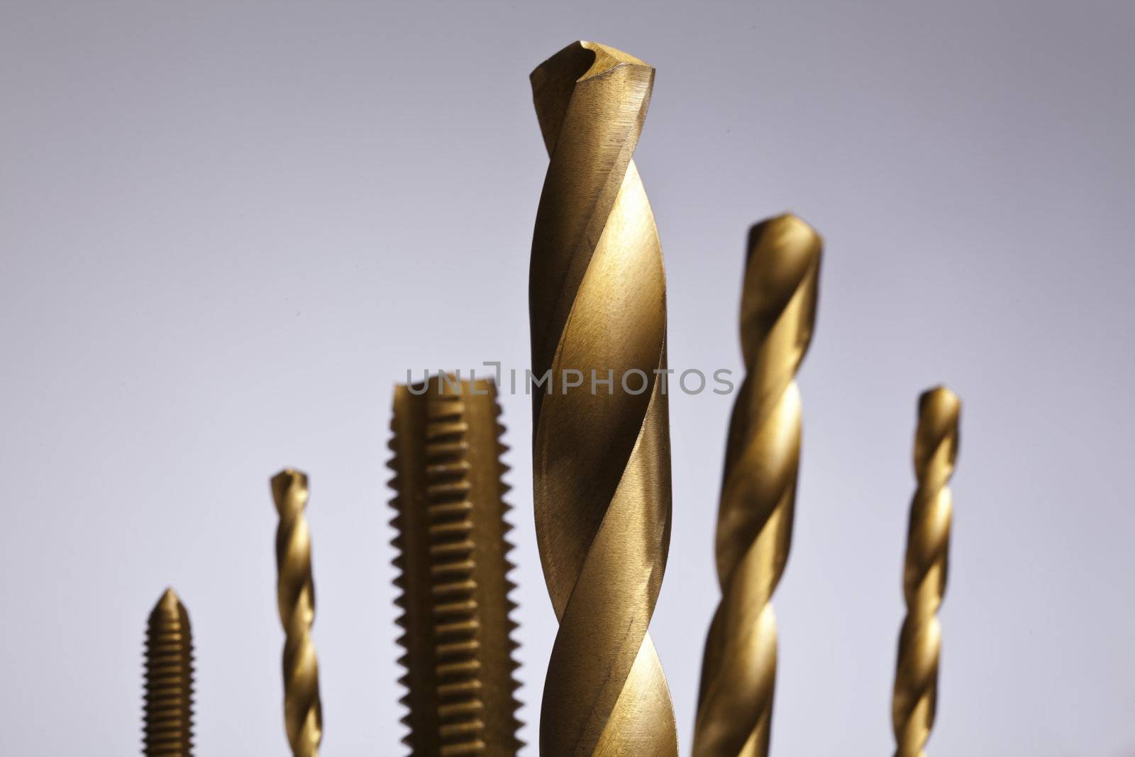Image of Drill bit sizes isolated on a gray background 