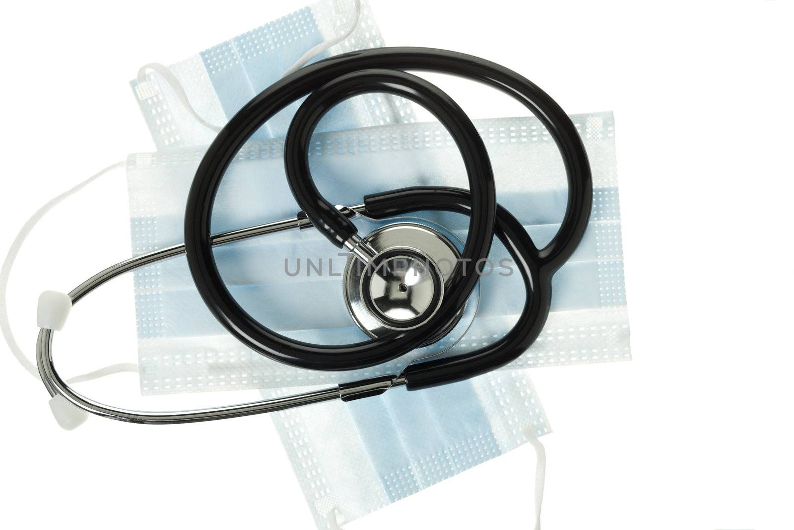 Stethoscope and surgical mask displayed over white.