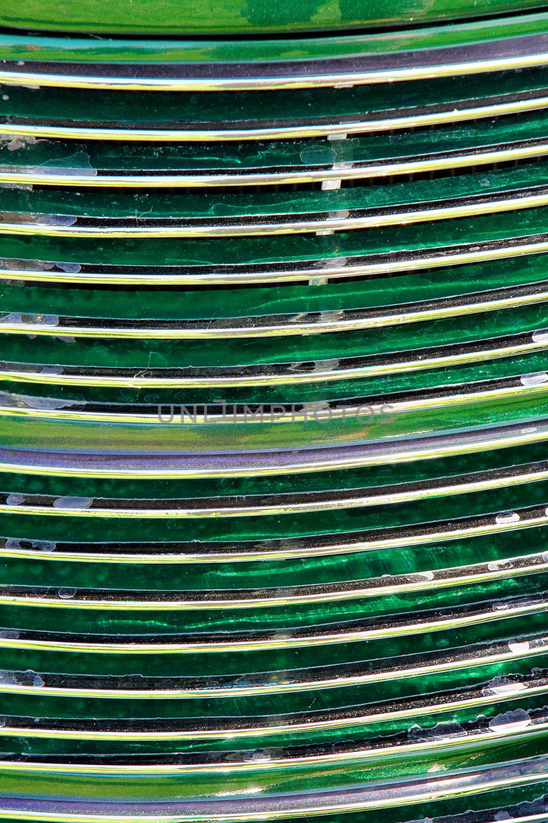 Grill of old or vontage car with custom green radiator metallic paint job, great abstract and texture background.