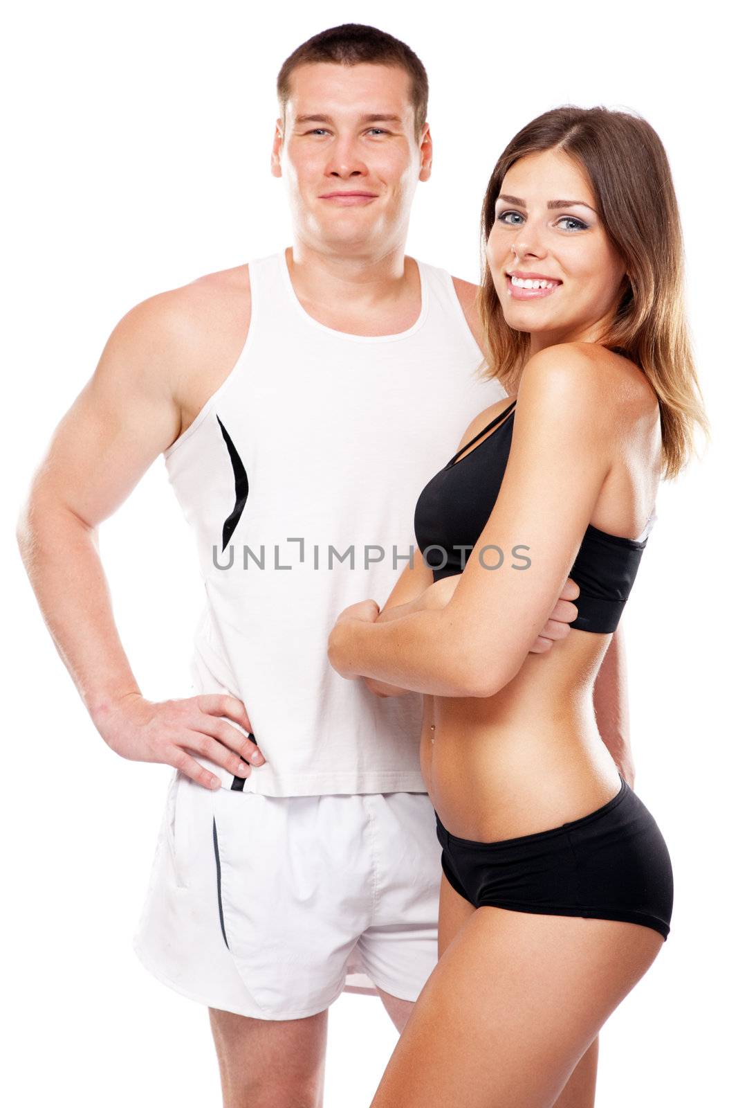 Beautiful healthy-looking young couple in sports outfit