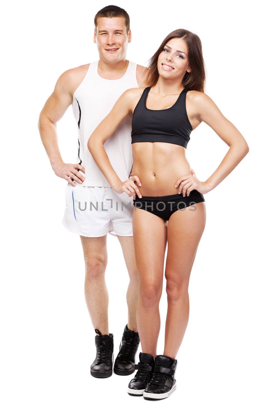 Beautiful healthy-looking young couple in sports outfit