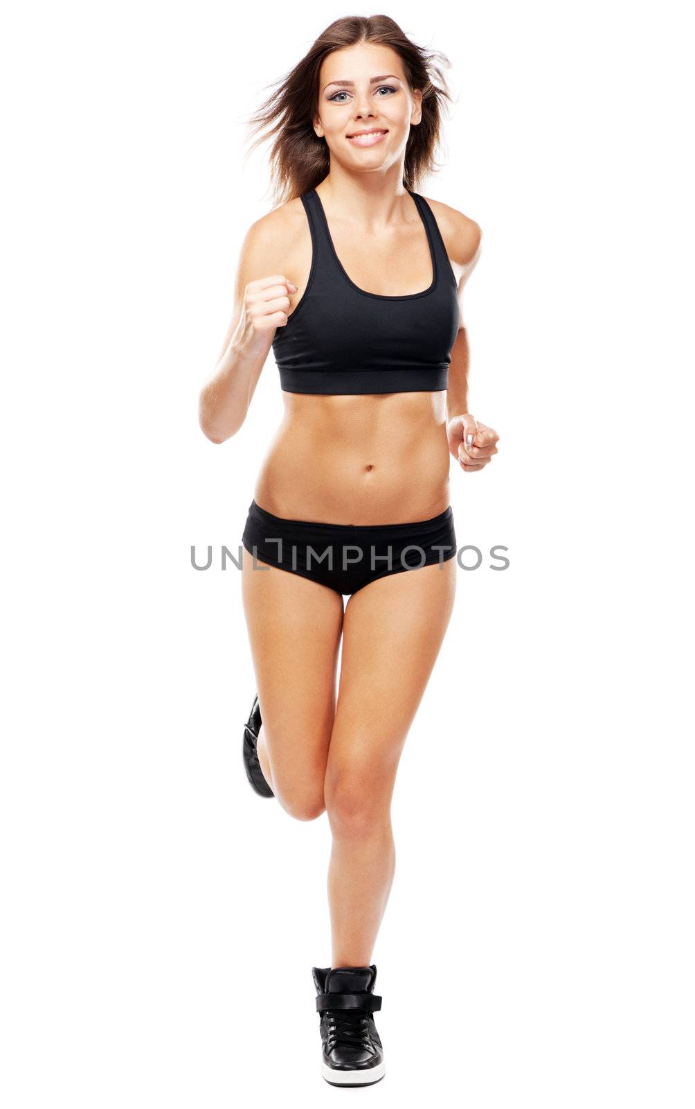 Young fit woman in sports outfit by Gdolgikh