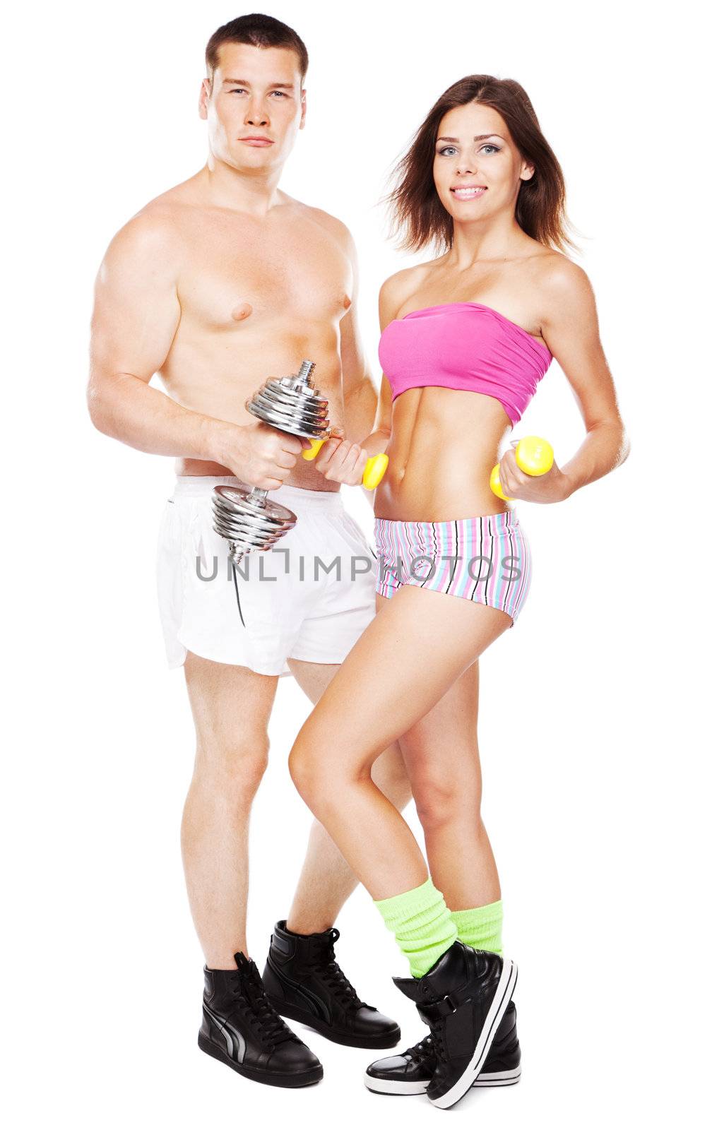 Beautiful healthy-looking young couple in sports outfit