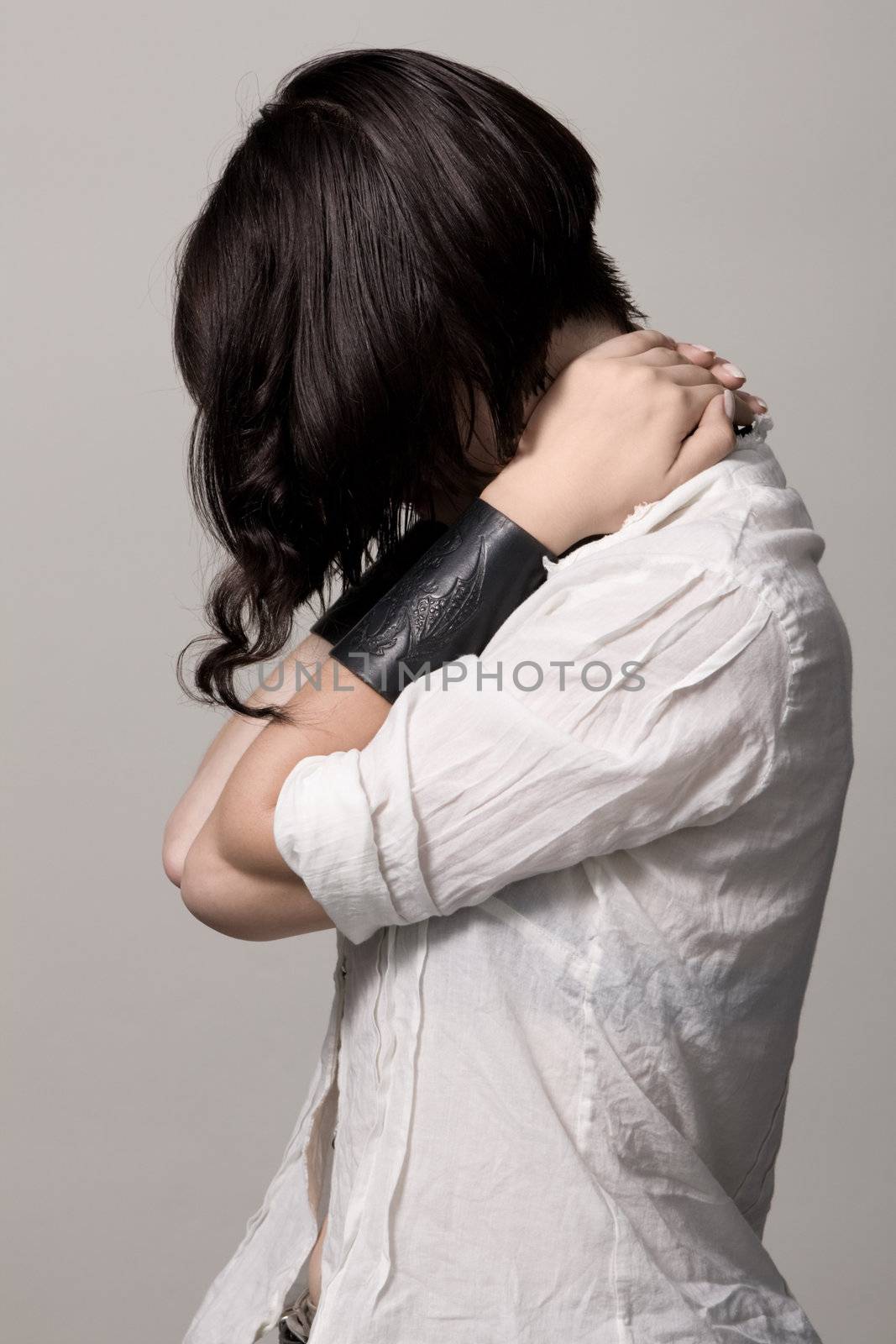 Beautiful young woman photo with accent on hairstyle