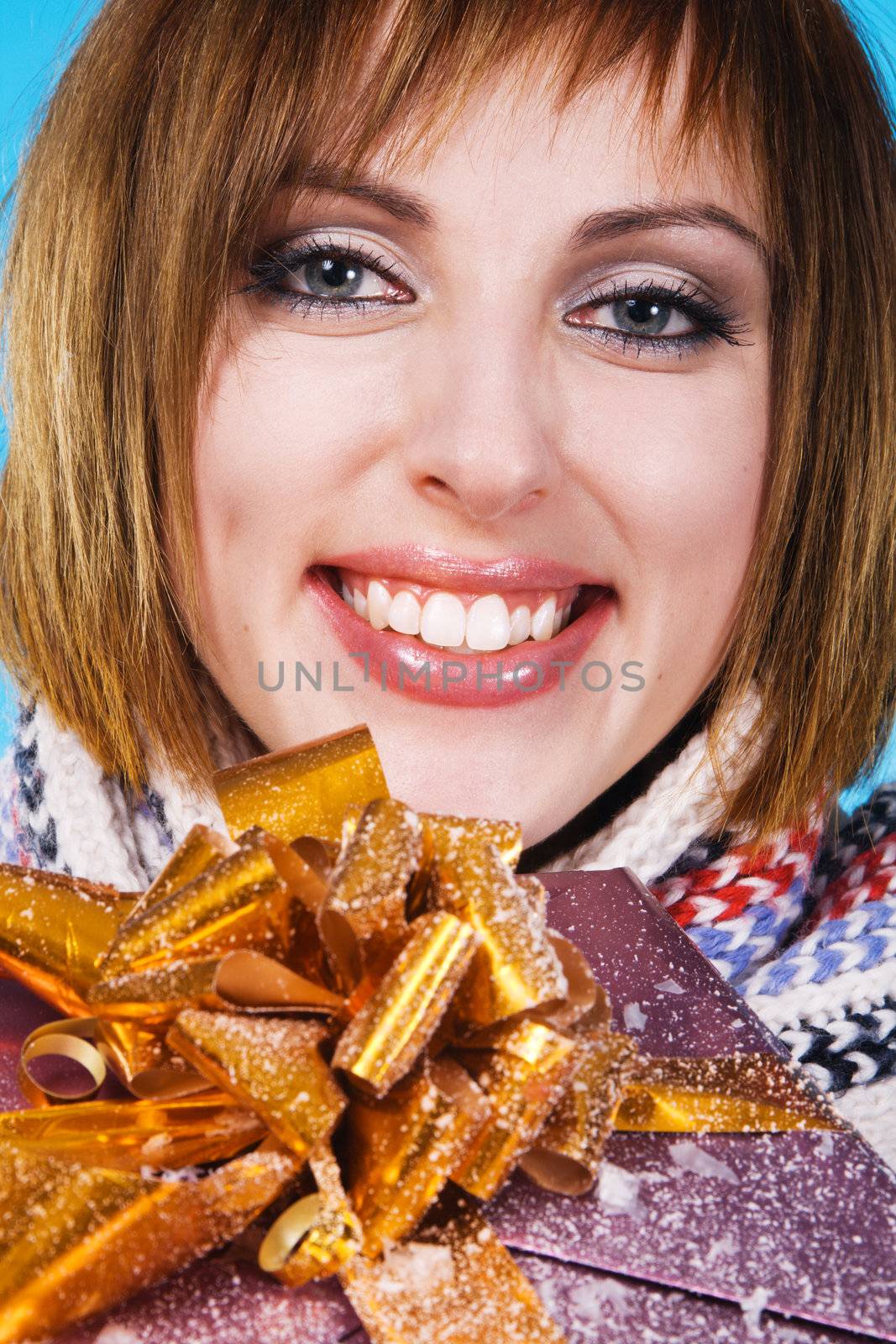 Closeup portrait of lovely girl with Xmas gift