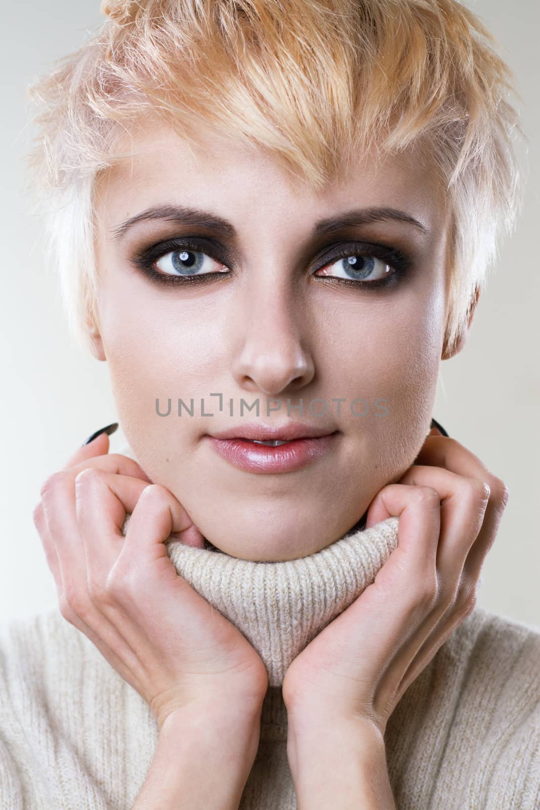 Closeup portrait of a young stylish blonde 