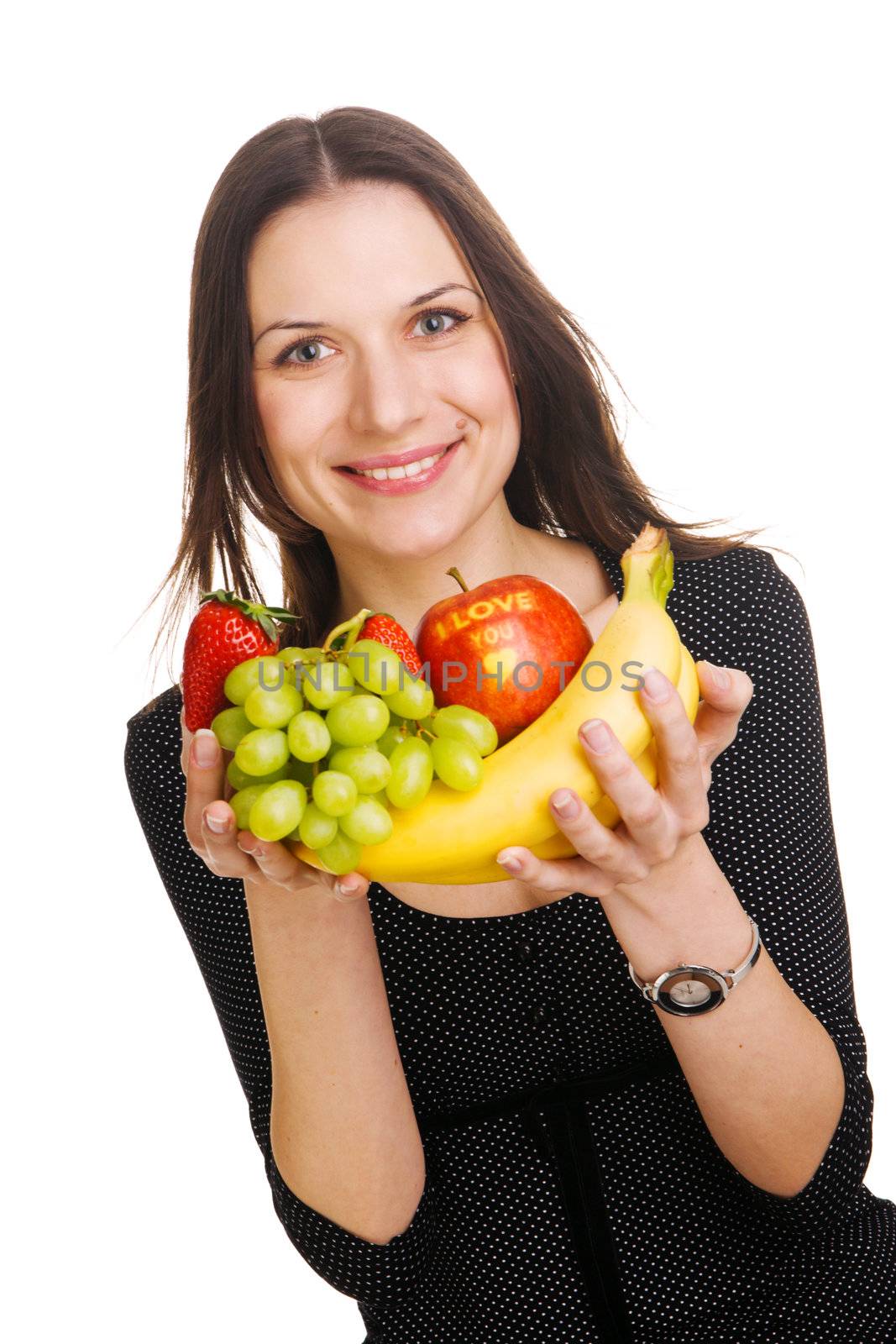 Beautiful young woman with a bunch of fruits, with "I love you" sign on apple