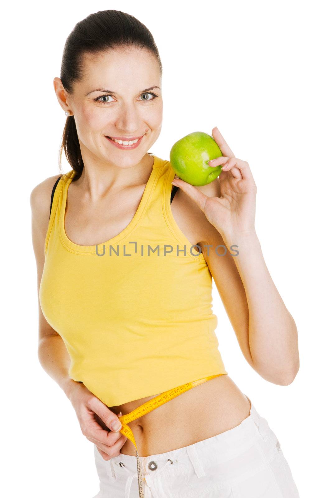 Beautiful slim woman holding a green apple, white background