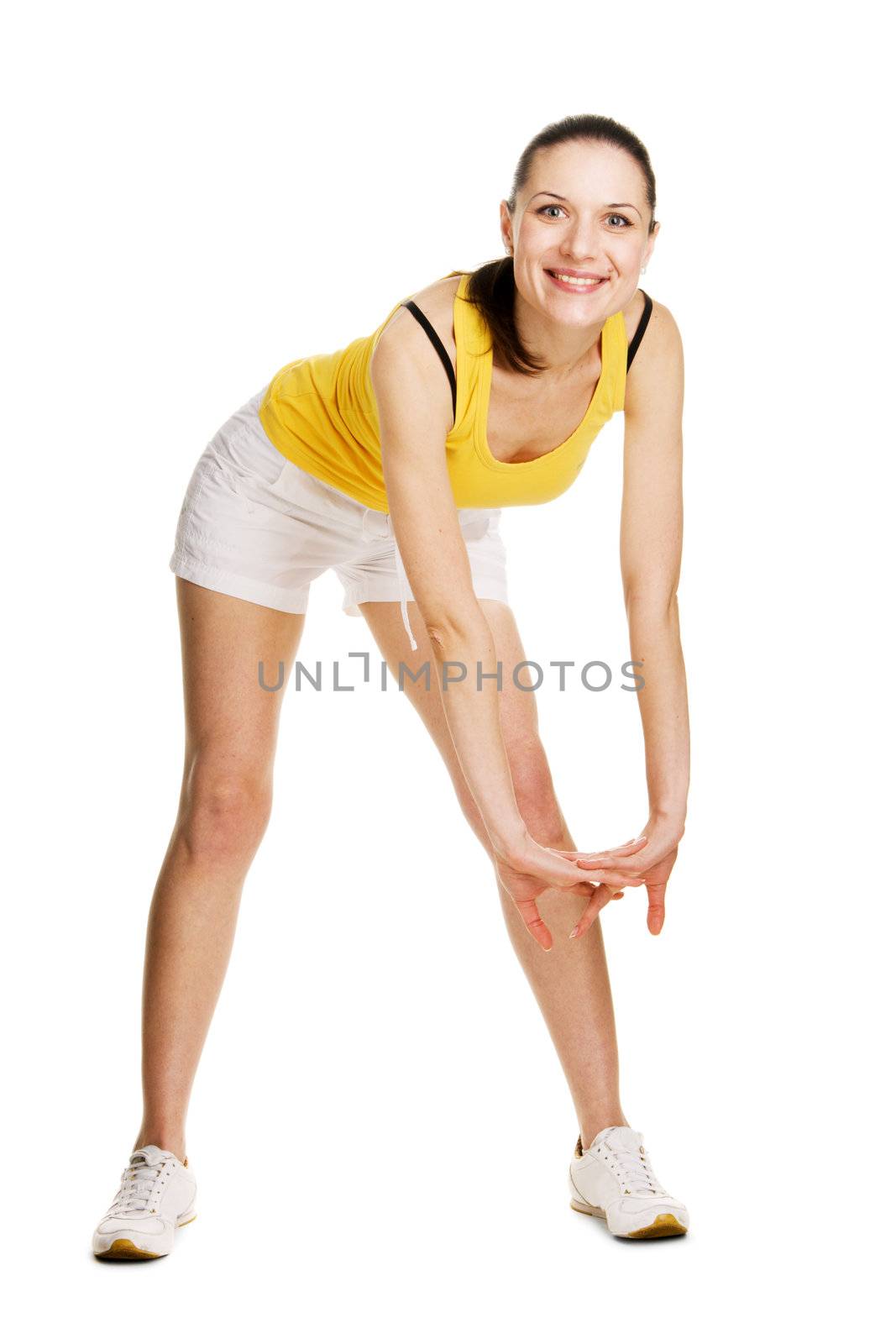 Beautiful young girl in sports outfit, white background