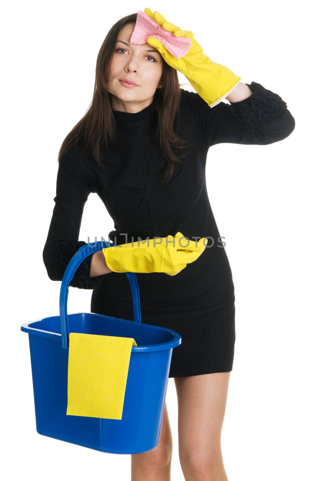 Young tired housewife in elegant dress holding a swab and bucket, white background 