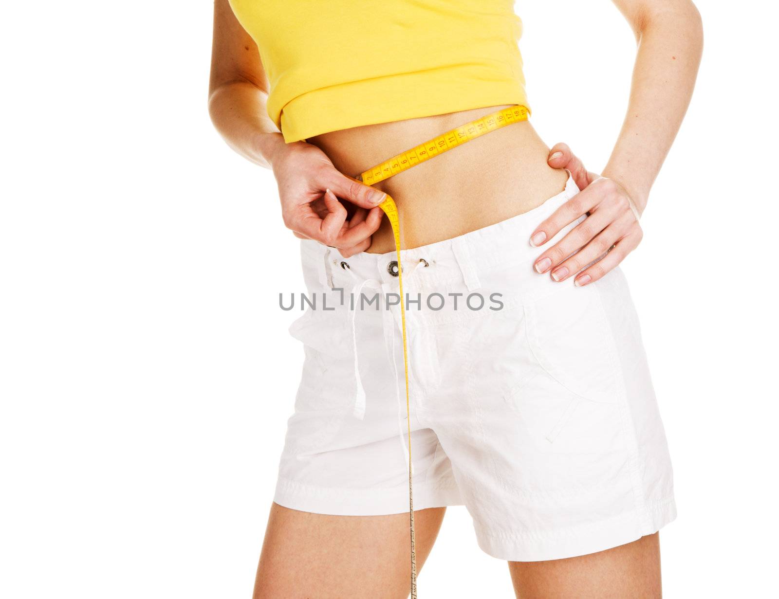 Young woman measuting her waist, white background