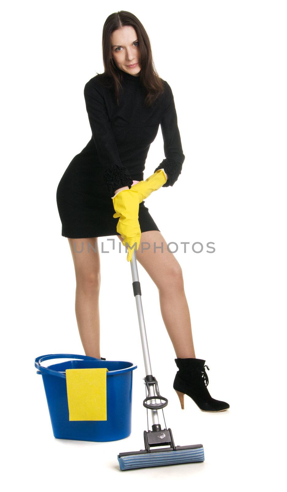 Sexy housewife in elegant dress holding a swab and bucket, white background