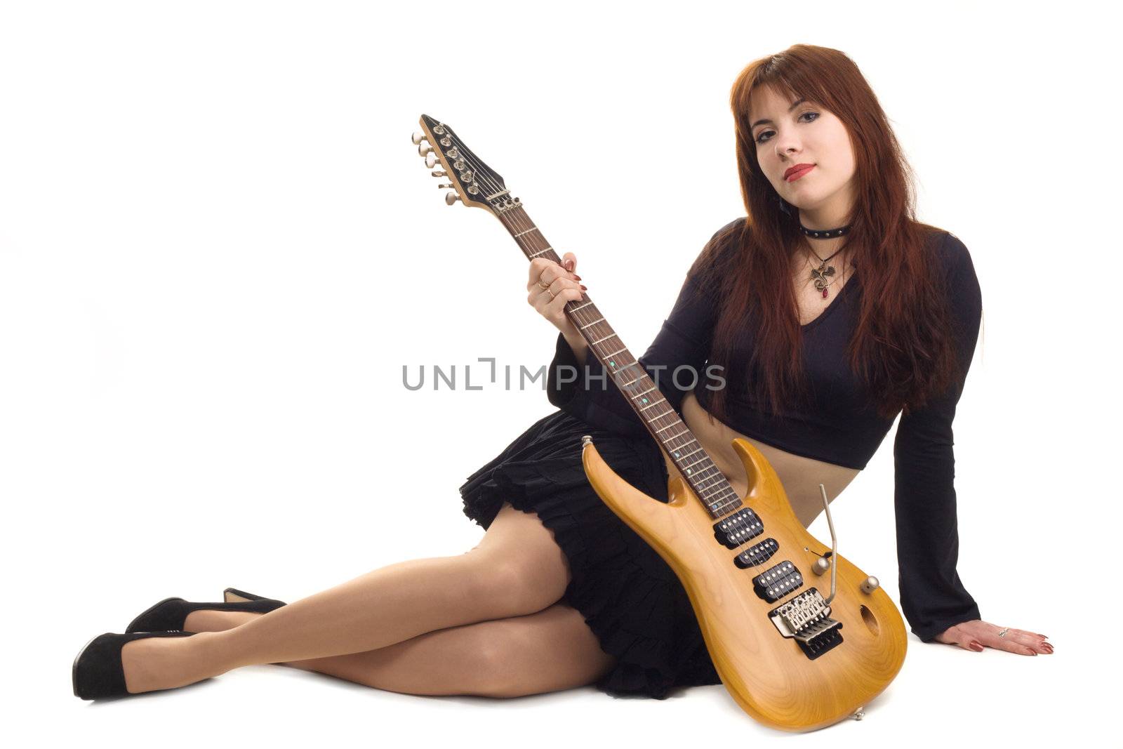 Girl dressed in black with an electric guitar, white background