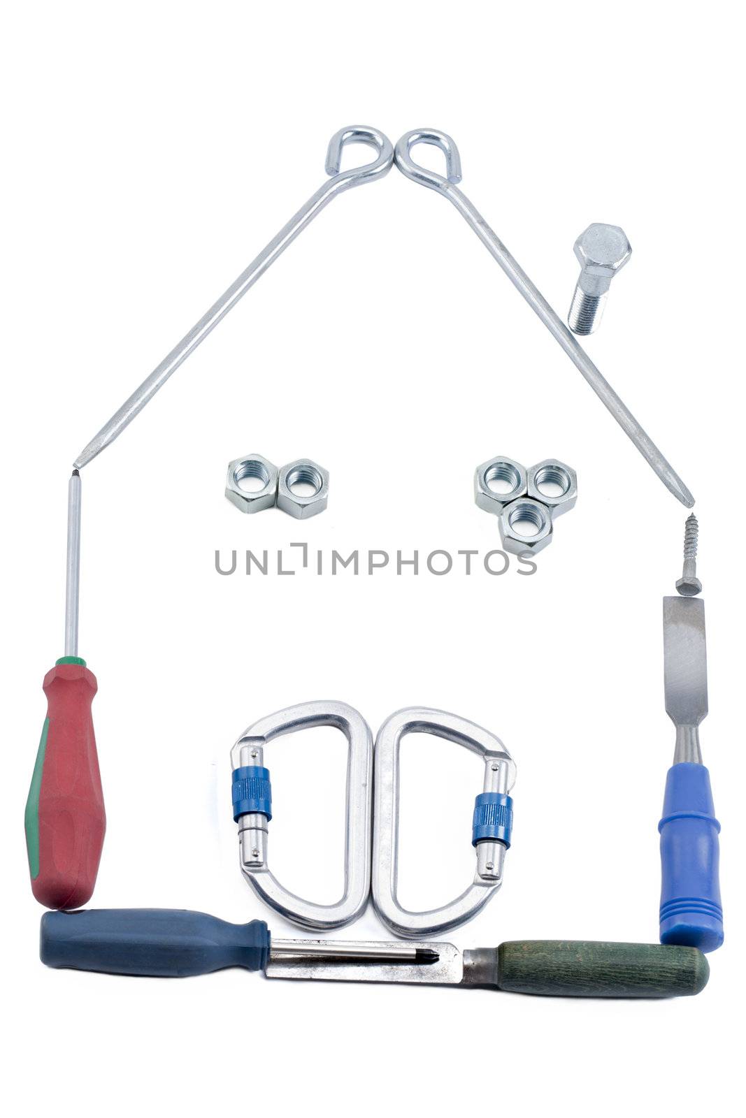 Close up image of house made of tools against white background