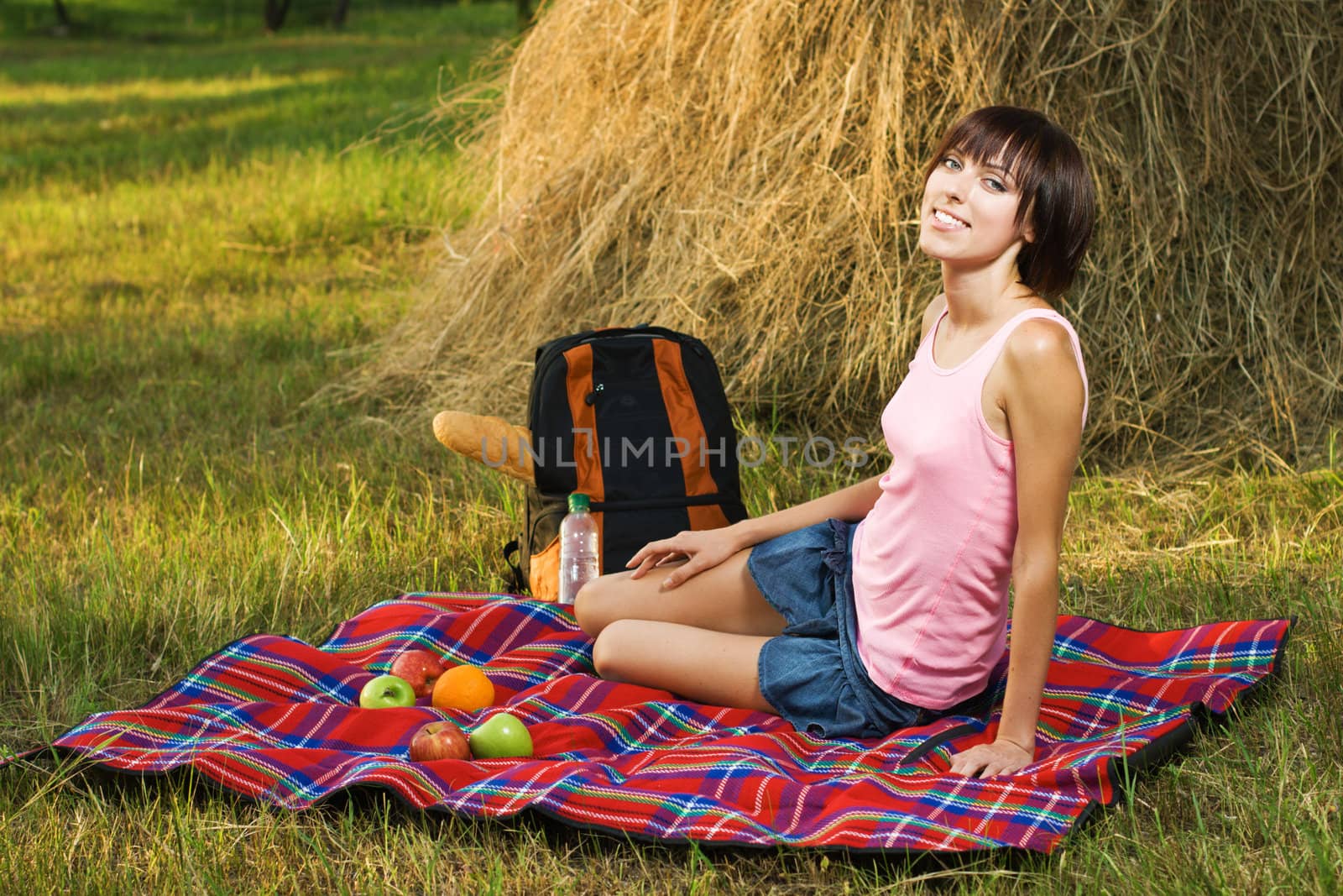 Lovely girl having a rest on picnic