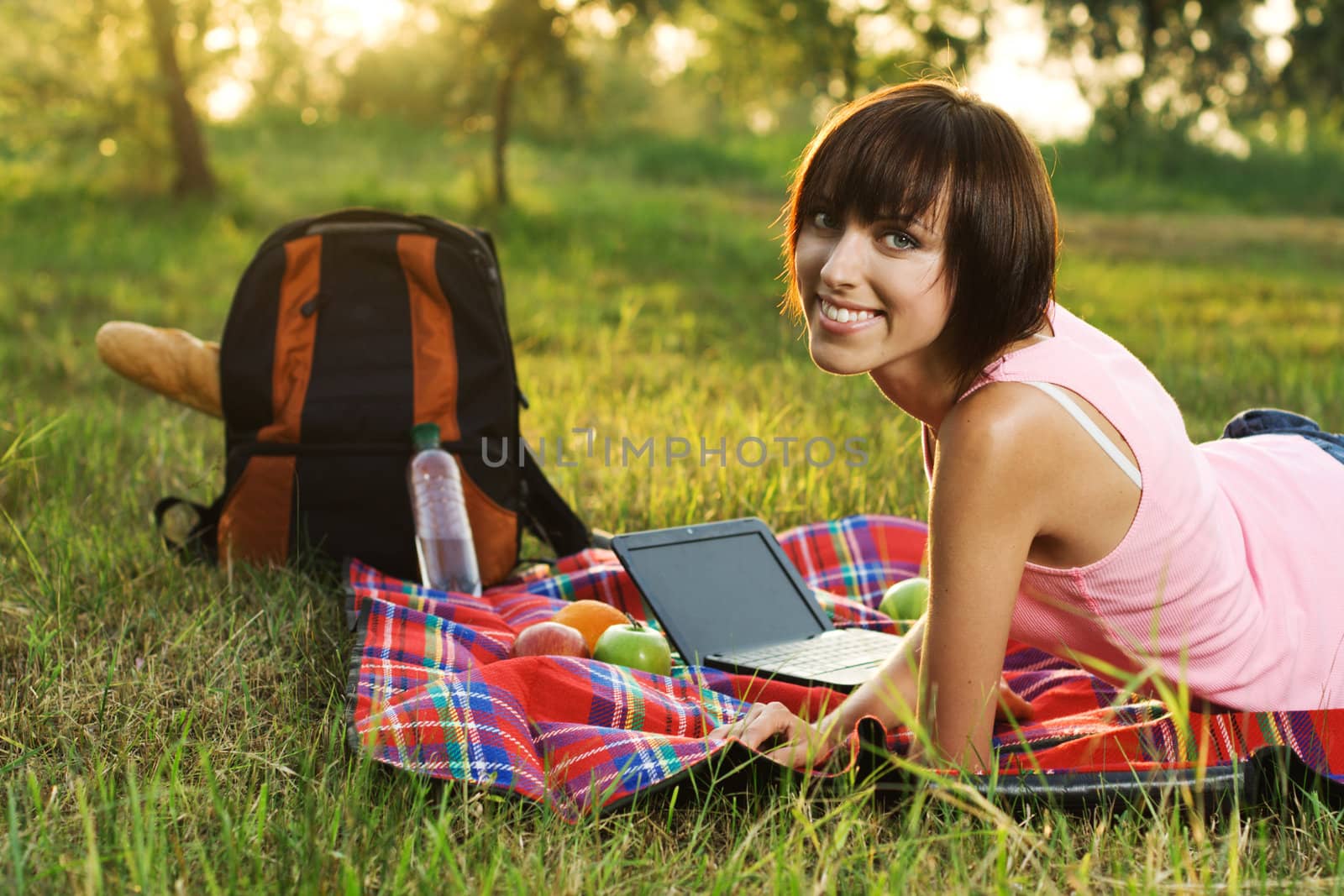 Lovely girl on picnic in the park  by Gdolgikh