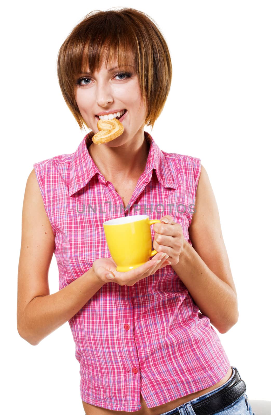 Cute girl with a tea cup biting a pretzel by Gdolgikh