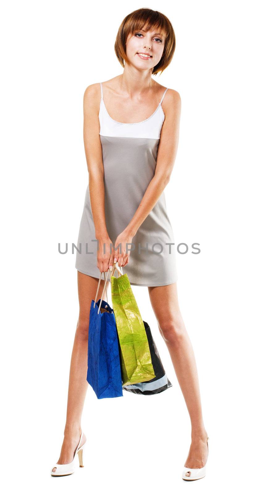 Lovely girl with shopping bags, isolated on white 
