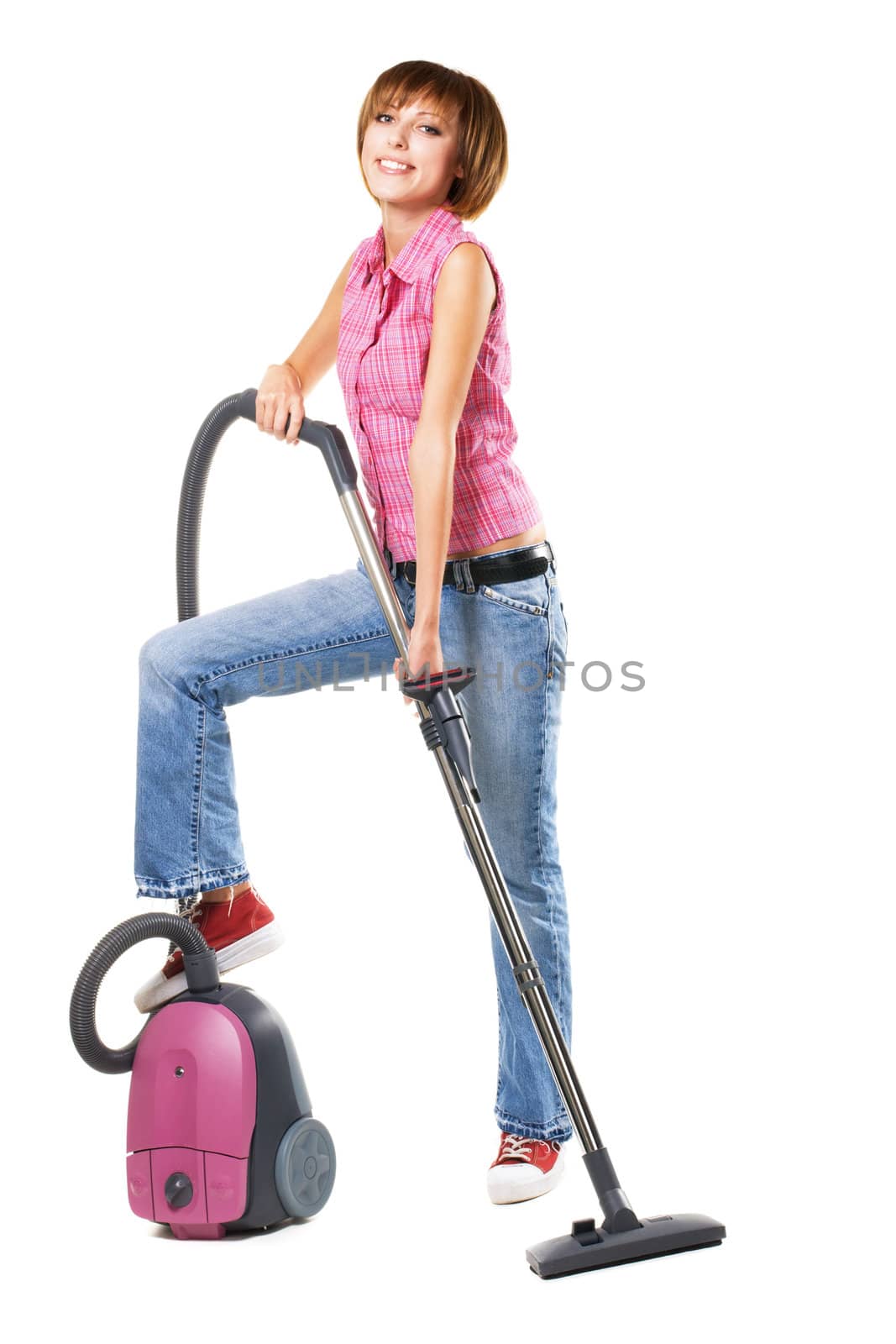 Young cheerful woman with vacuum cleaner by Gdolgikh