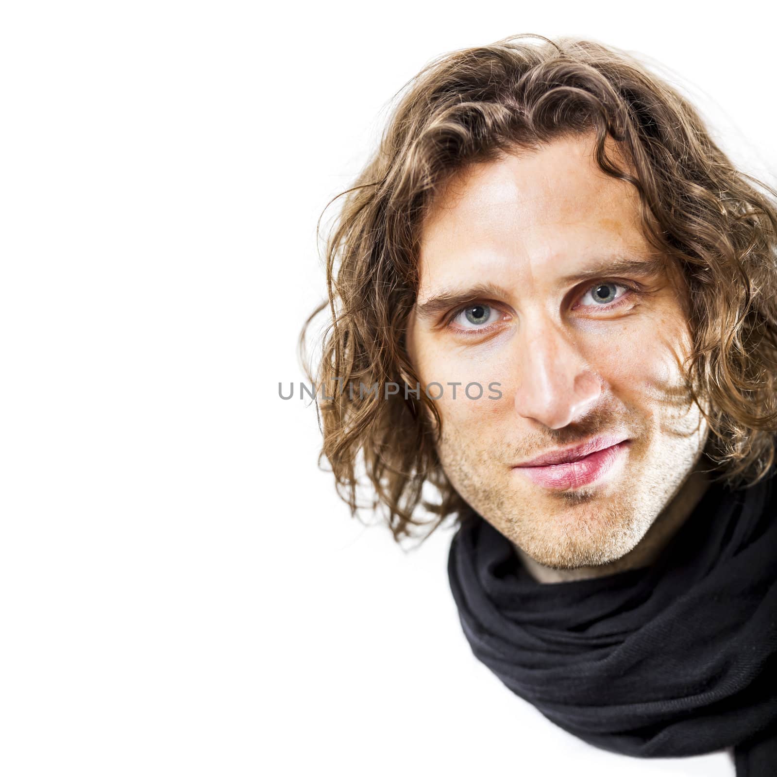 An image of a handsome man with a curly hairdo