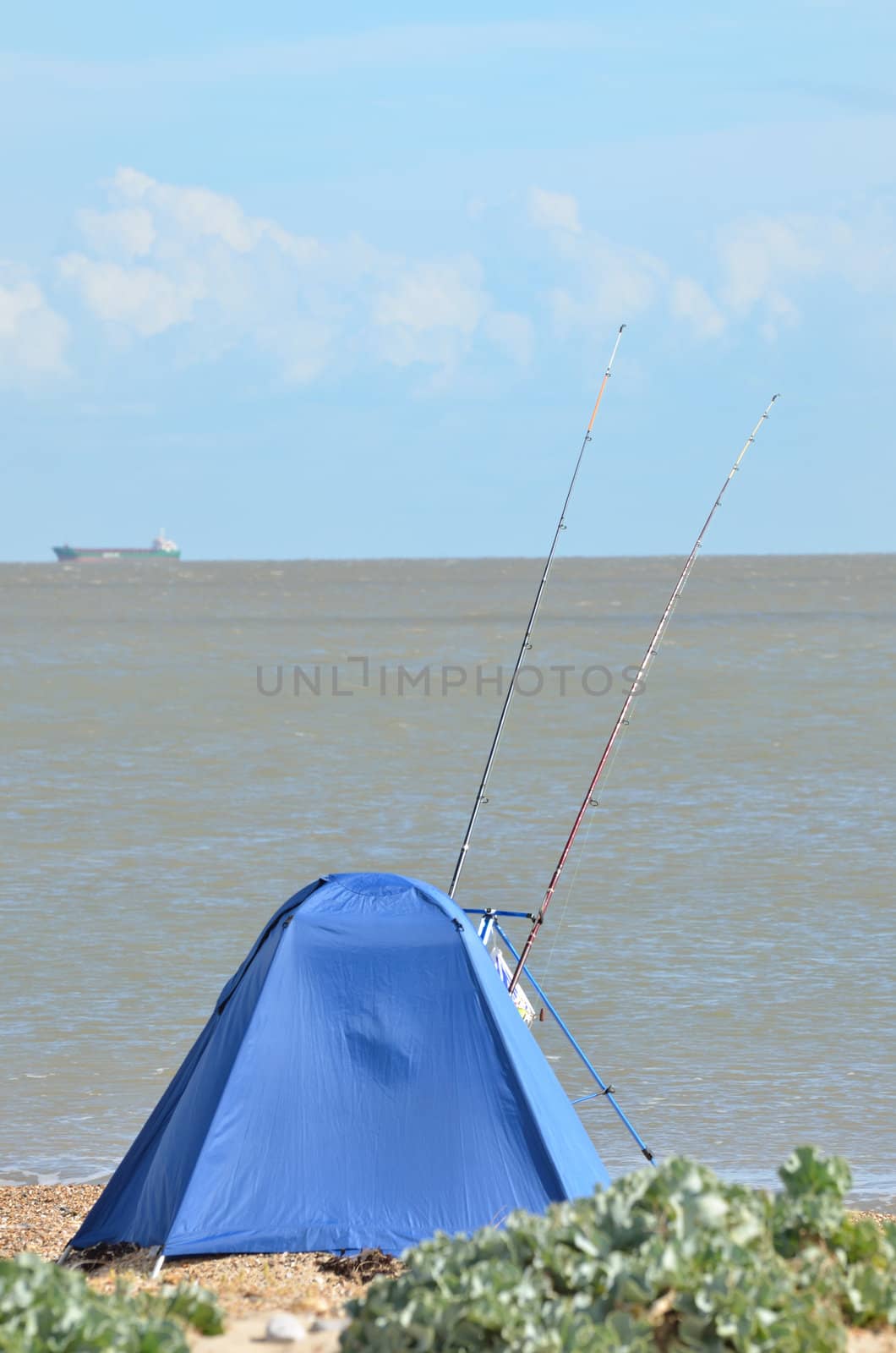 Sea fisherman behind shelter