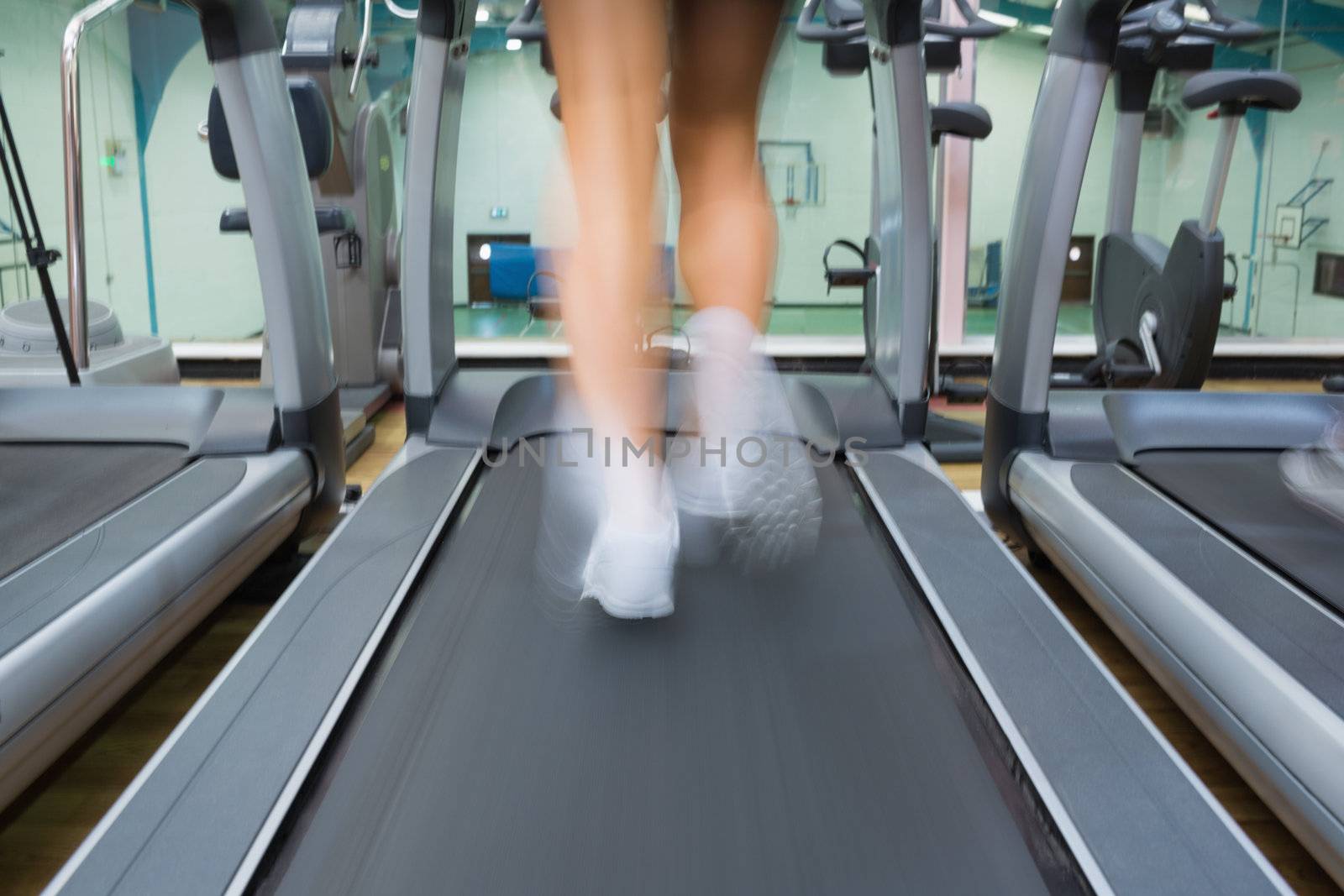 Running on a treadmill in the gym