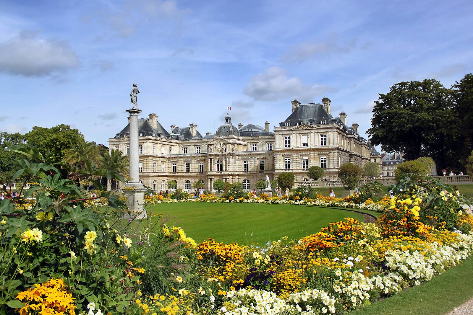 Luxembourg palace with flowers lawn in front. Paris, France