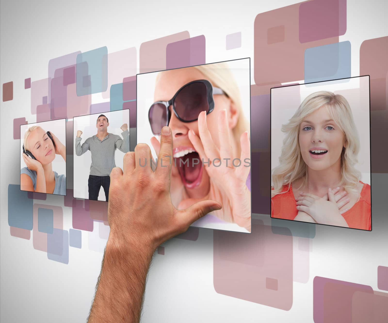 Male hand selecting photo from digital wall by Wavebreakmedia