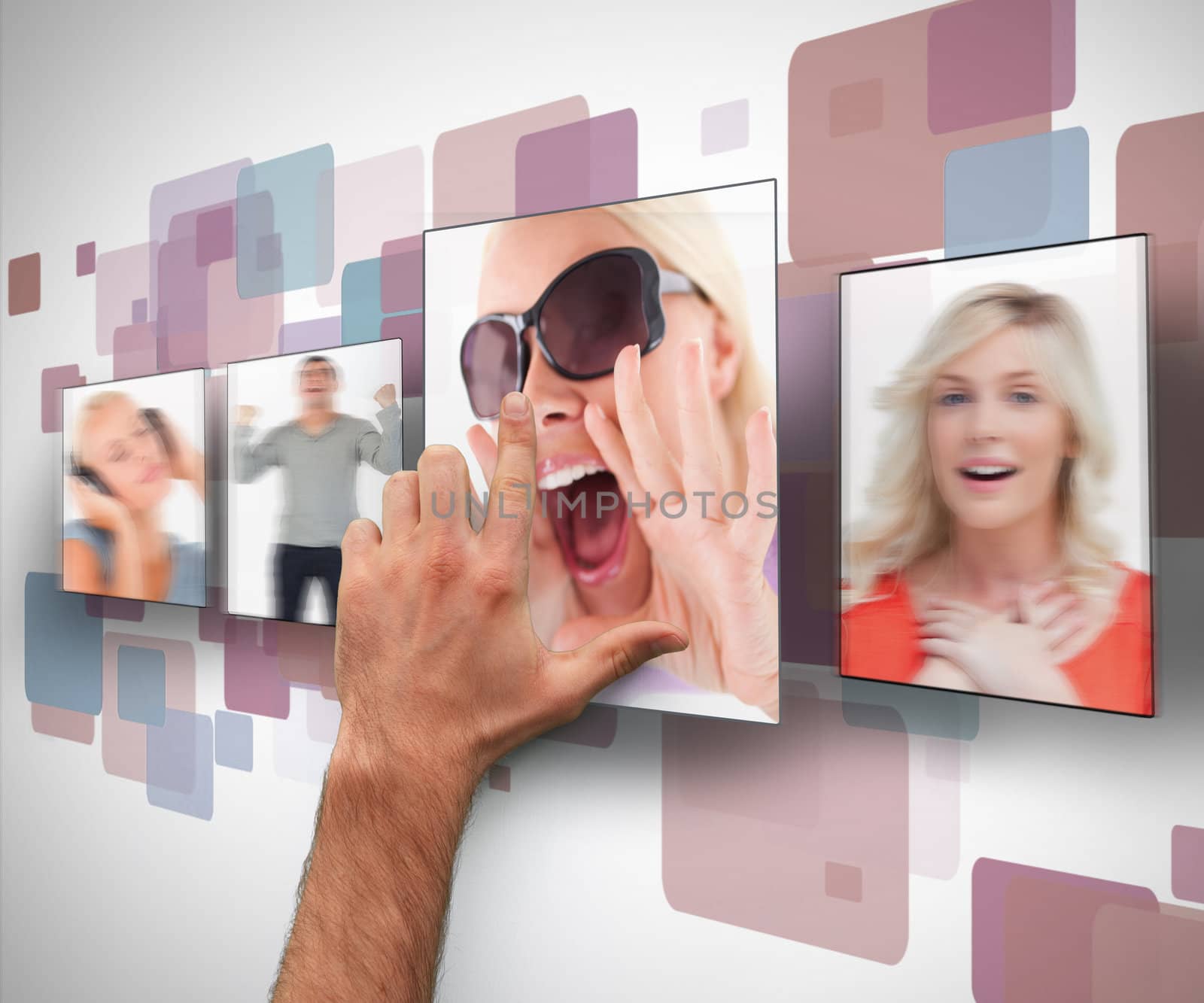 Male hand selecting one photo from digital white purple and blue wall