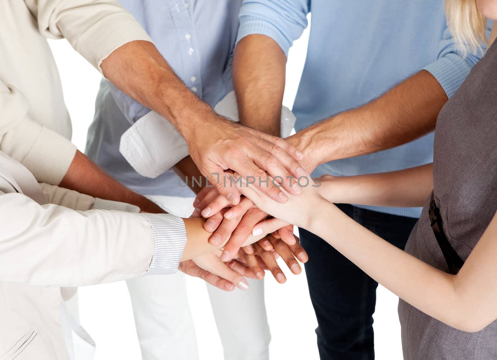 Closeup of a business colleagues with their hands stacked together