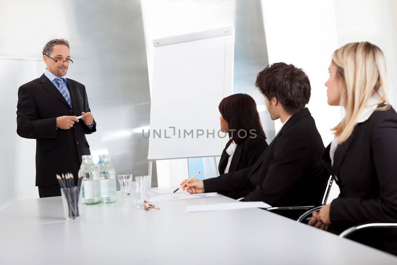 Group of business people at presentation by AndreyPopov