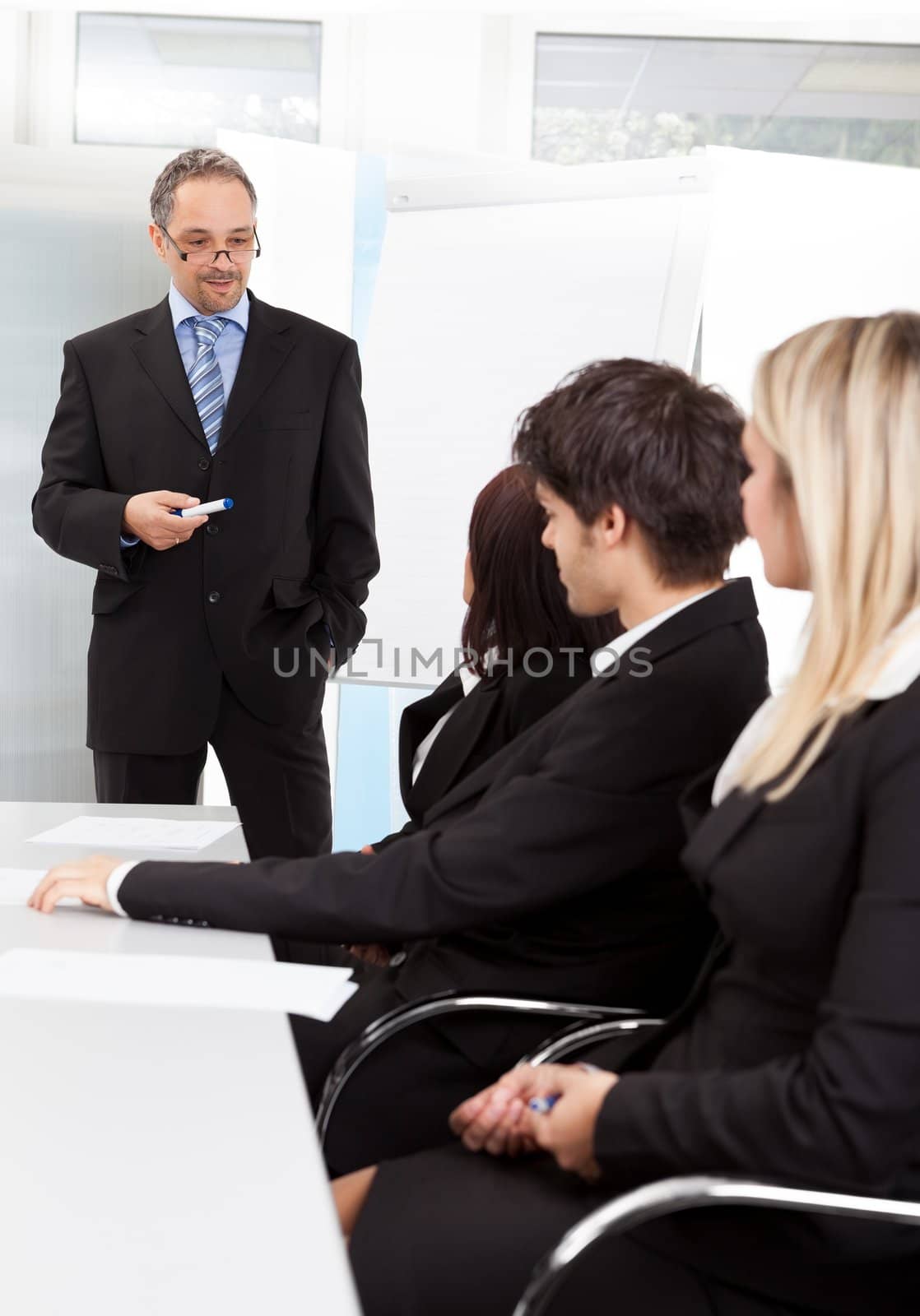 Group of business people at presentation in the office